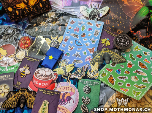 A spread of pins, stickers, art prints, masks, and other products featuring original insect-inspired designs by Moth Monarch.