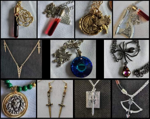 A variety of jewelry featuring fantasy items such as axes, blood vial pendants, and other charms.