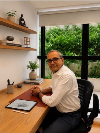 Hemal Surti at his desk