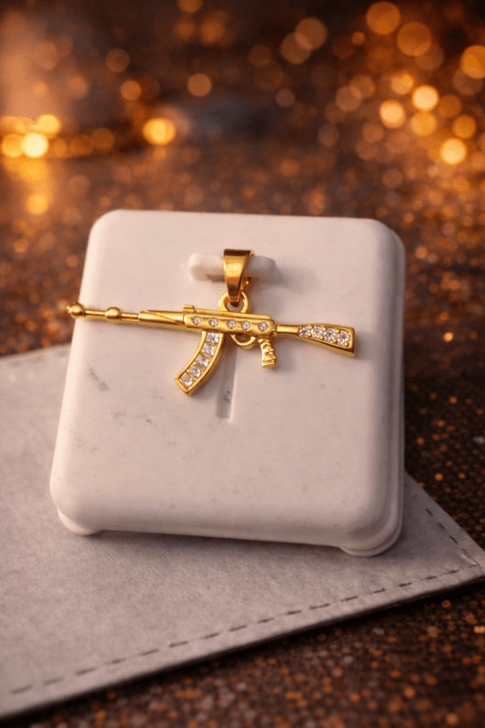 Gold Tone Rifle Pendant