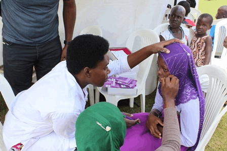 Clinic staff helping a patient