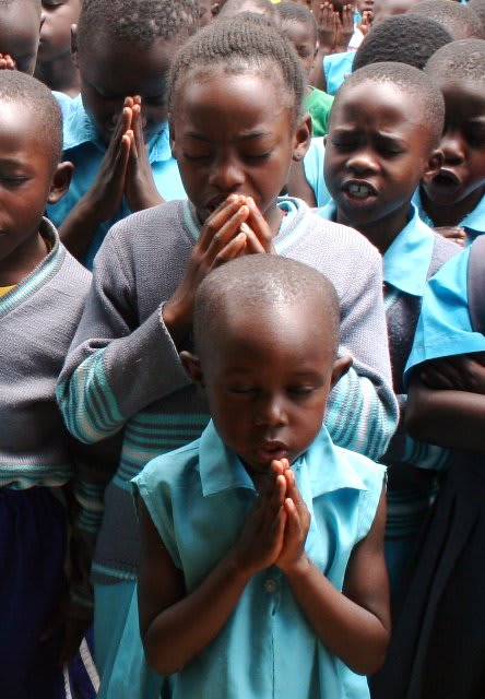 Ugandan children praying