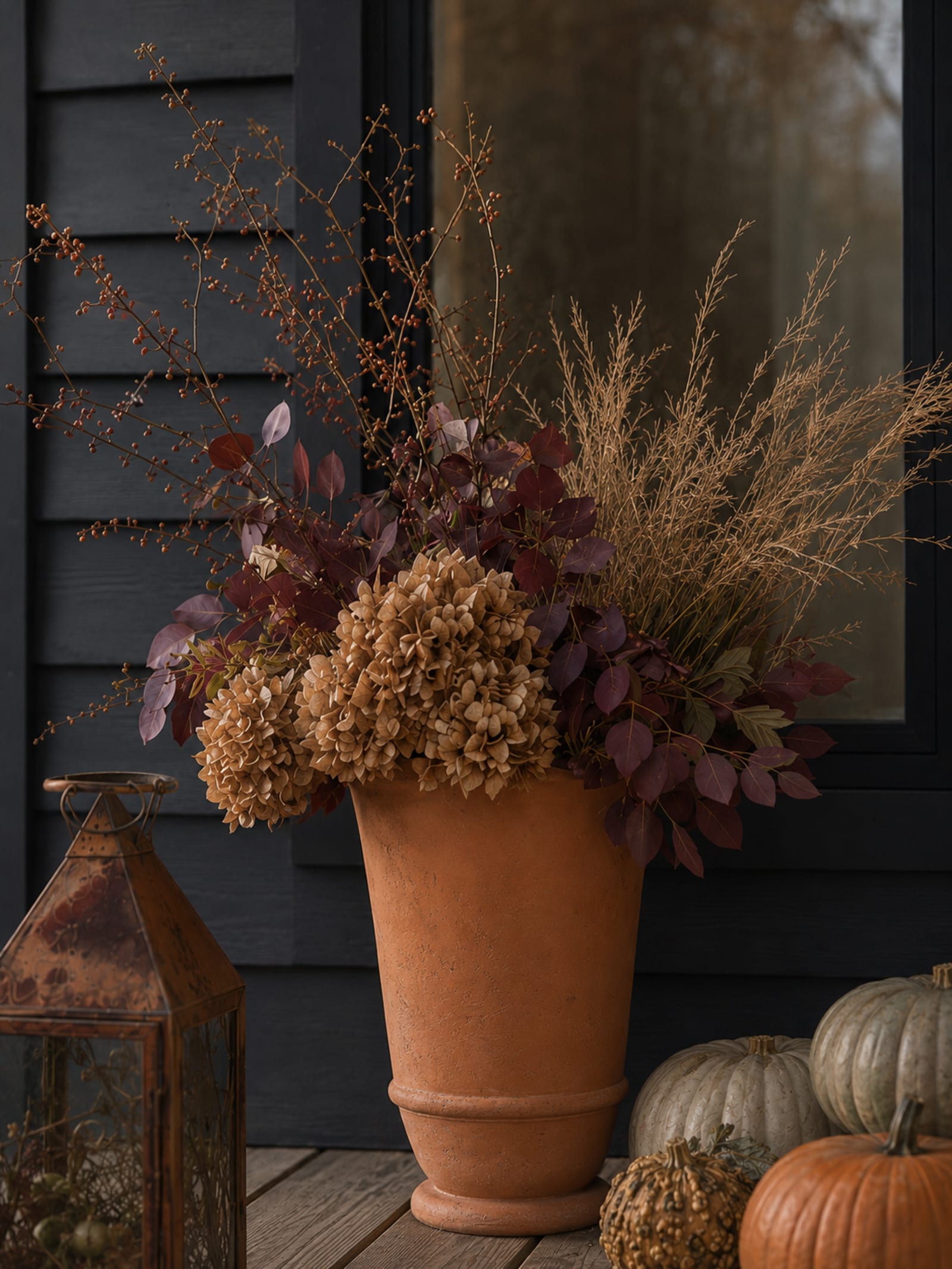 A close view of an autumn urn arrangement by Hearthly.