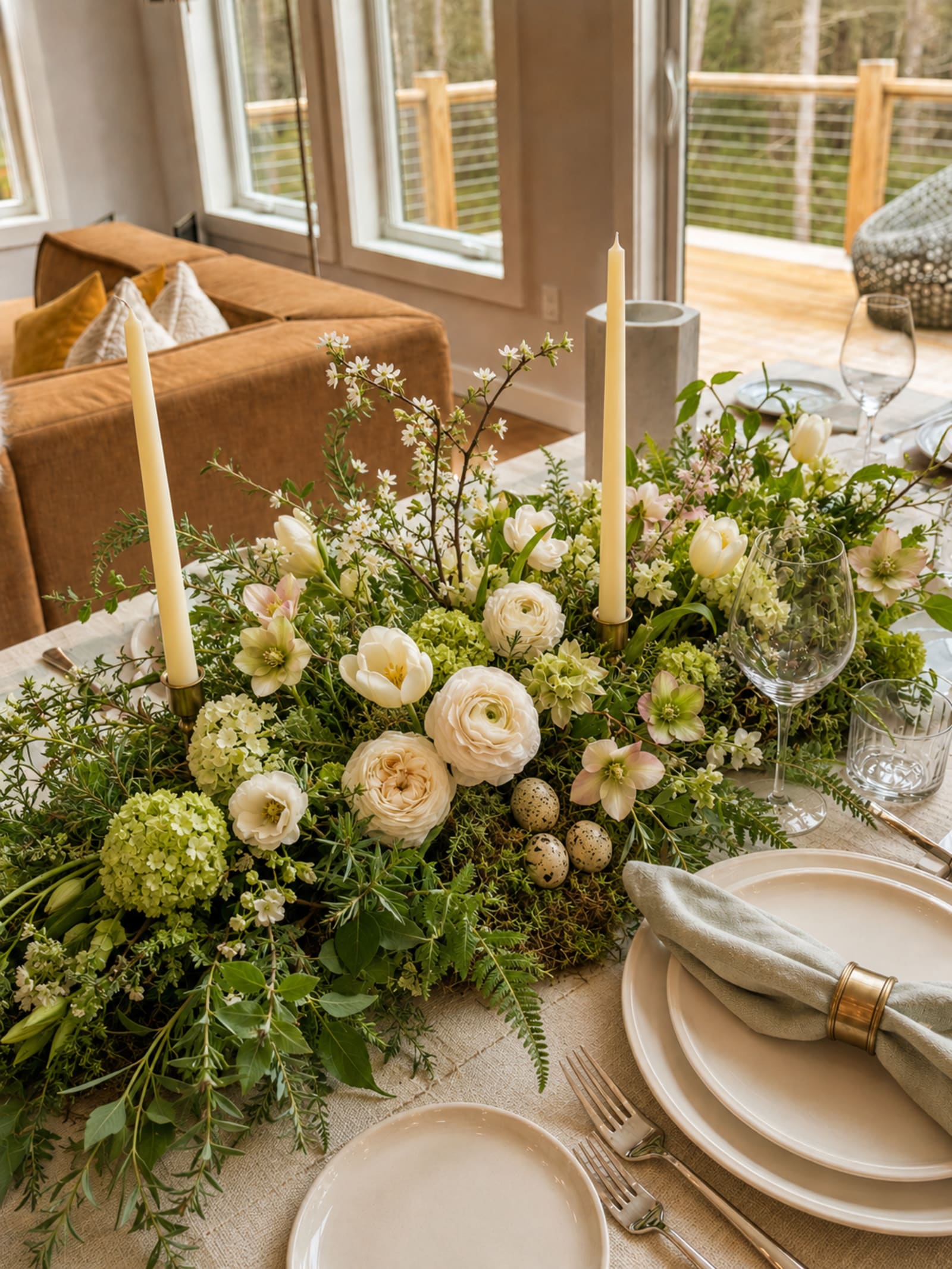 A spring botanical table by Hearthly, layered with branches, foliage, and flowers.