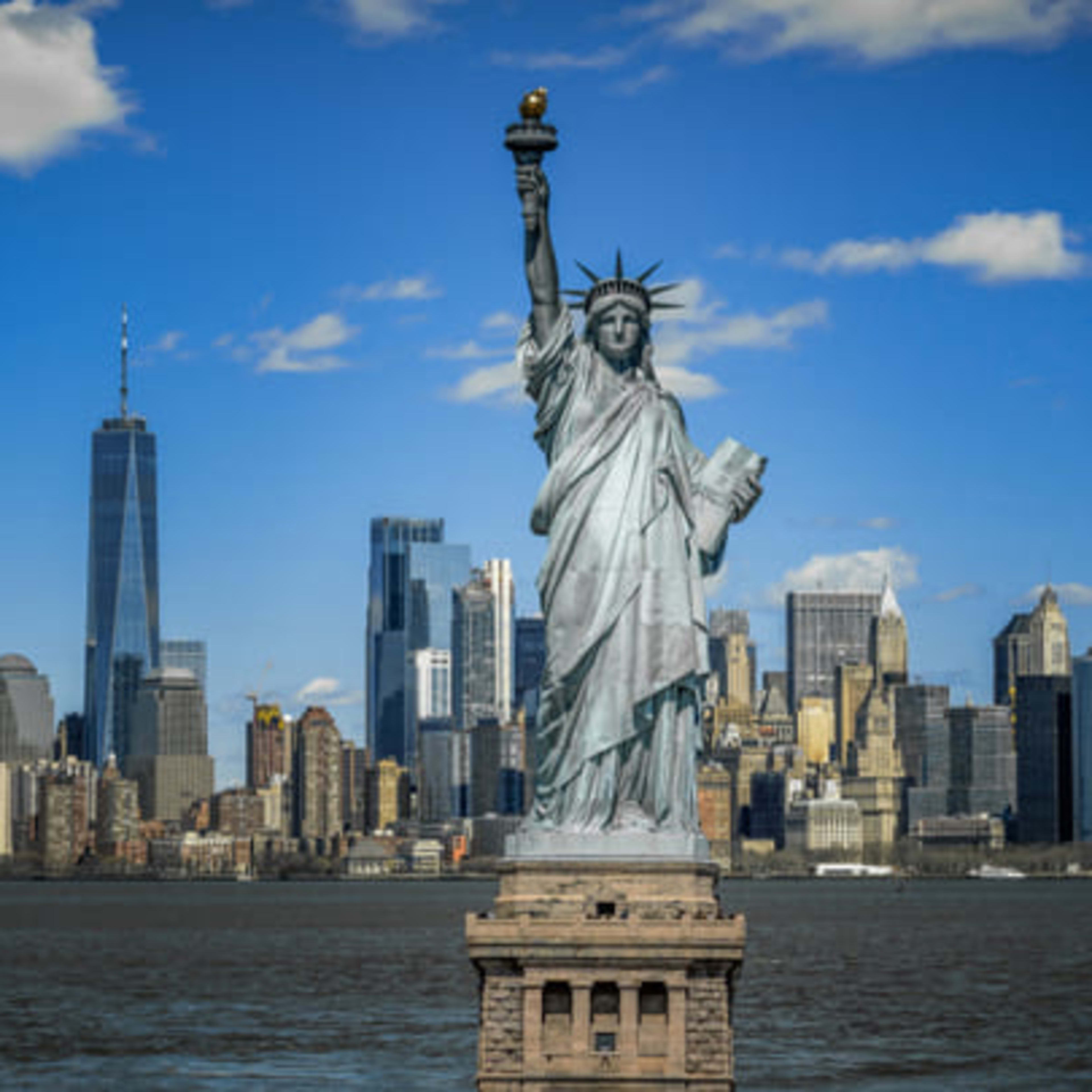 Statue of Liberty in front of the Manhattan skyline