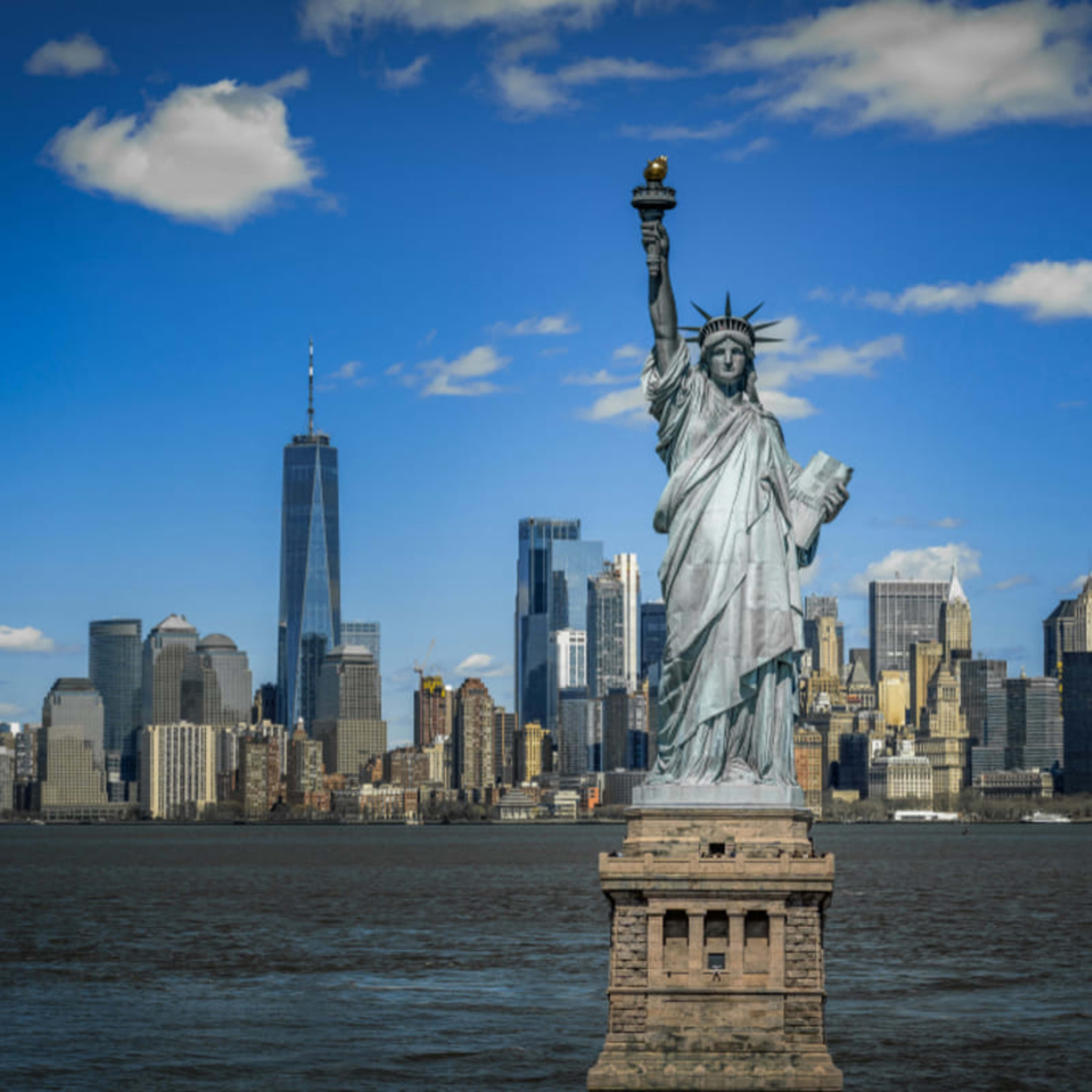 Statue of Liberty in front of the Manhattan skyline