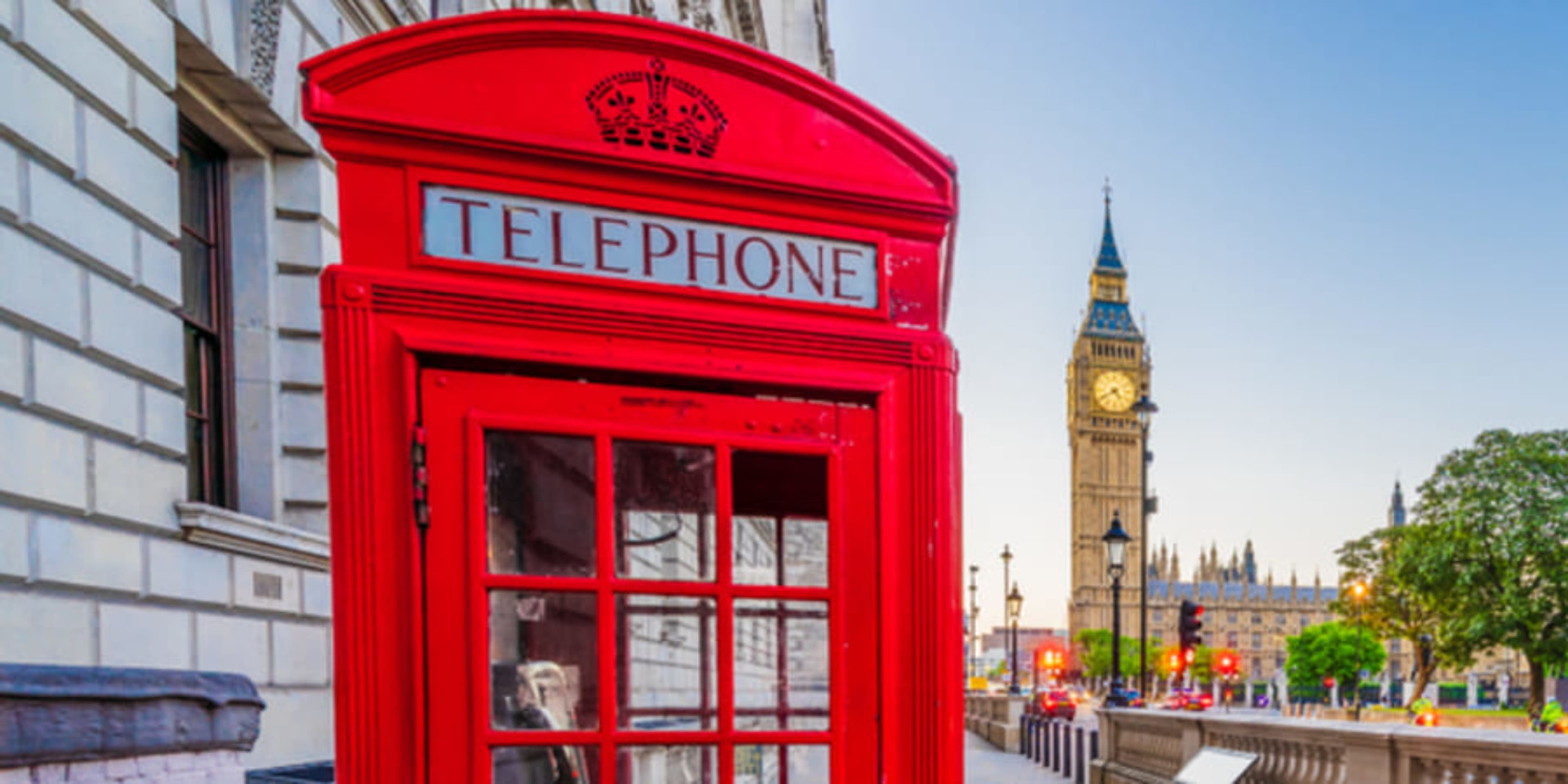 Bright red phone box in front of Big Ben and the Houses of Parliament