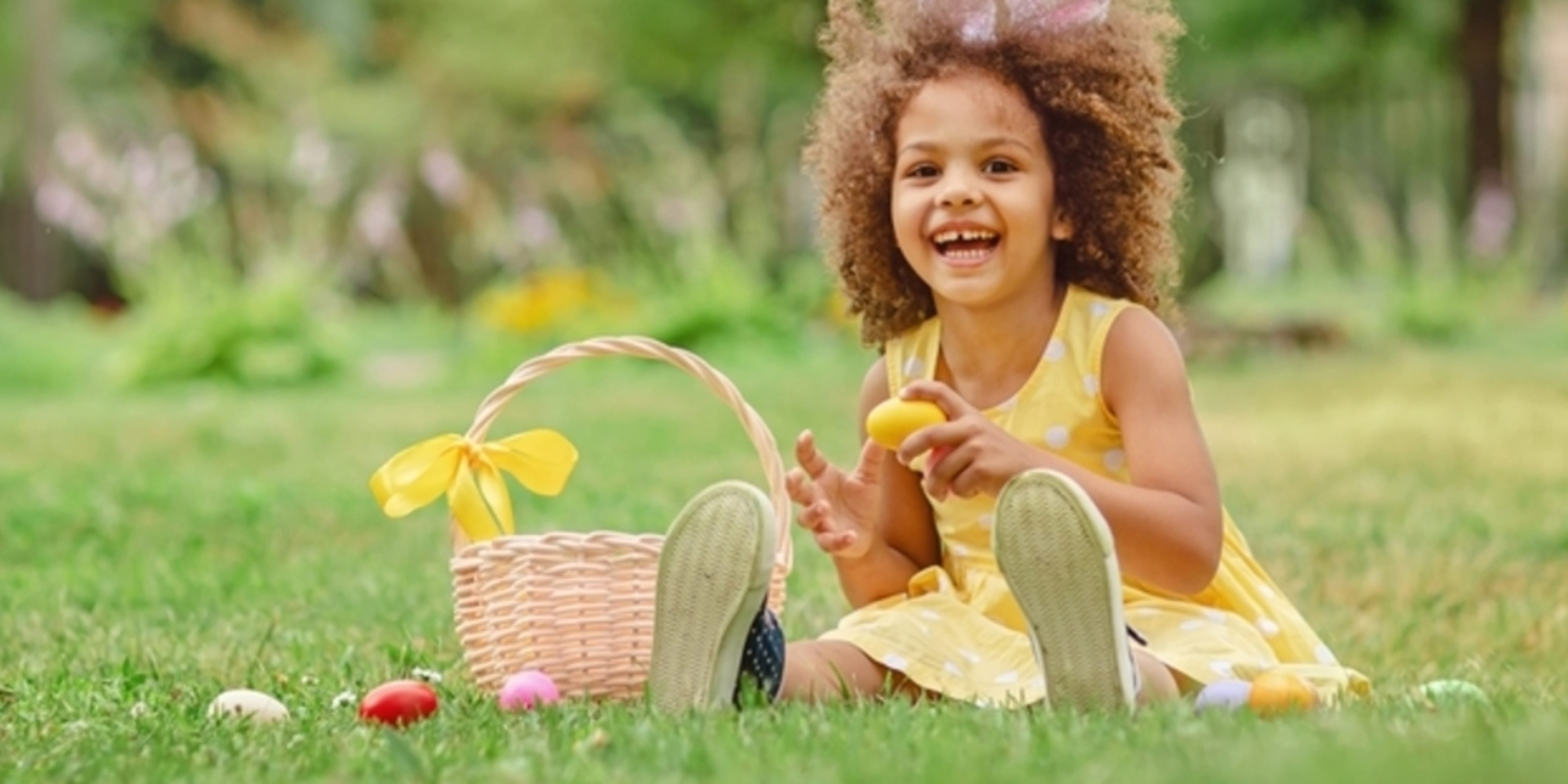 Little girl on a traditional Easter egg hunt.