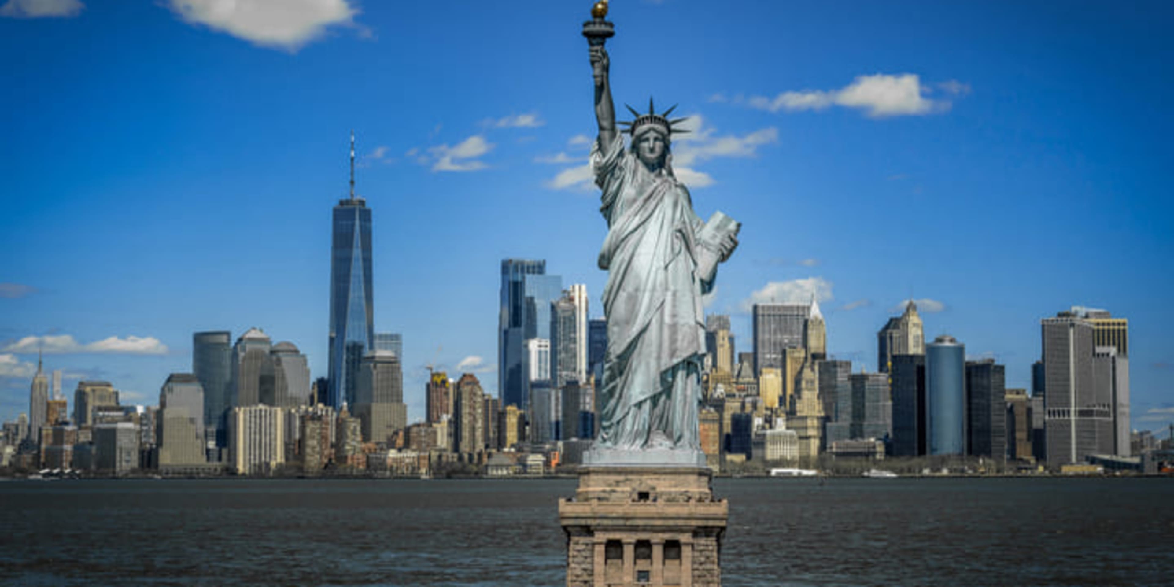 Statue of Liberty in front of the Manhattan skyline