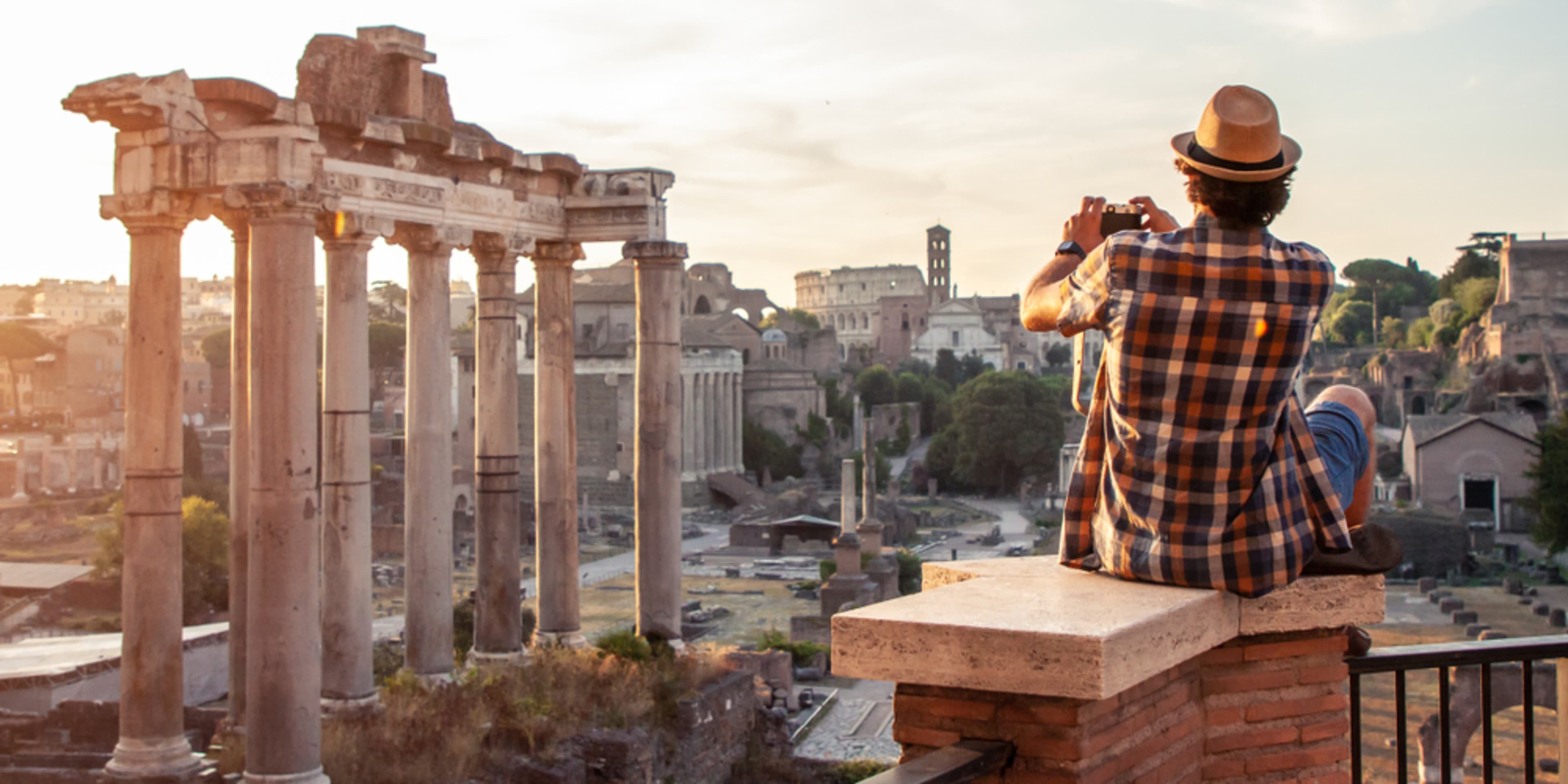 Tourist taking sunrise photos at the Roman Forum