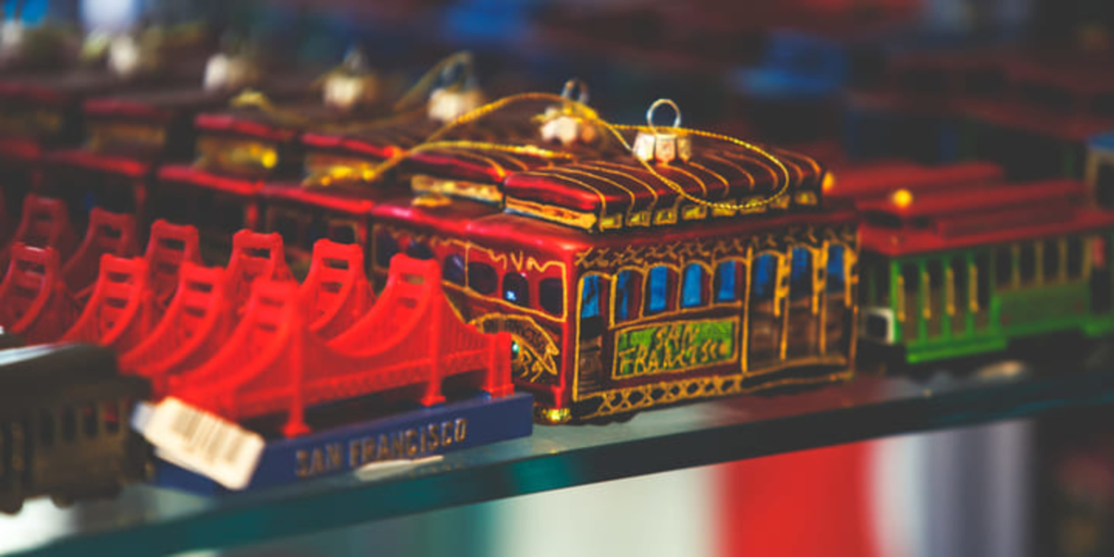 Selection of San Francisco souvenirs including cable car and Golden Gate Bridge ornaments