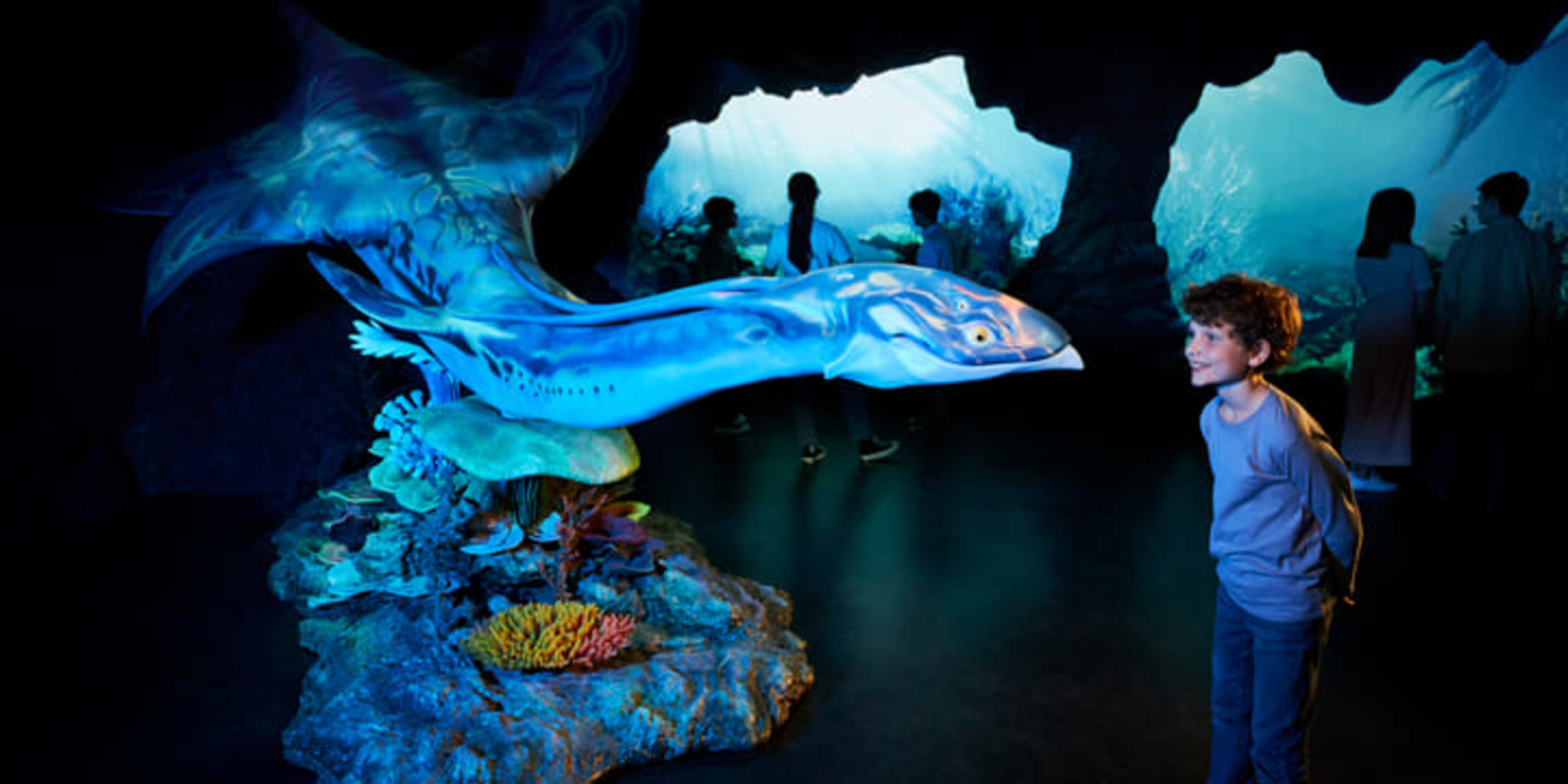 Child meeting an Ilu from the movie Avatar: The Way of Water.