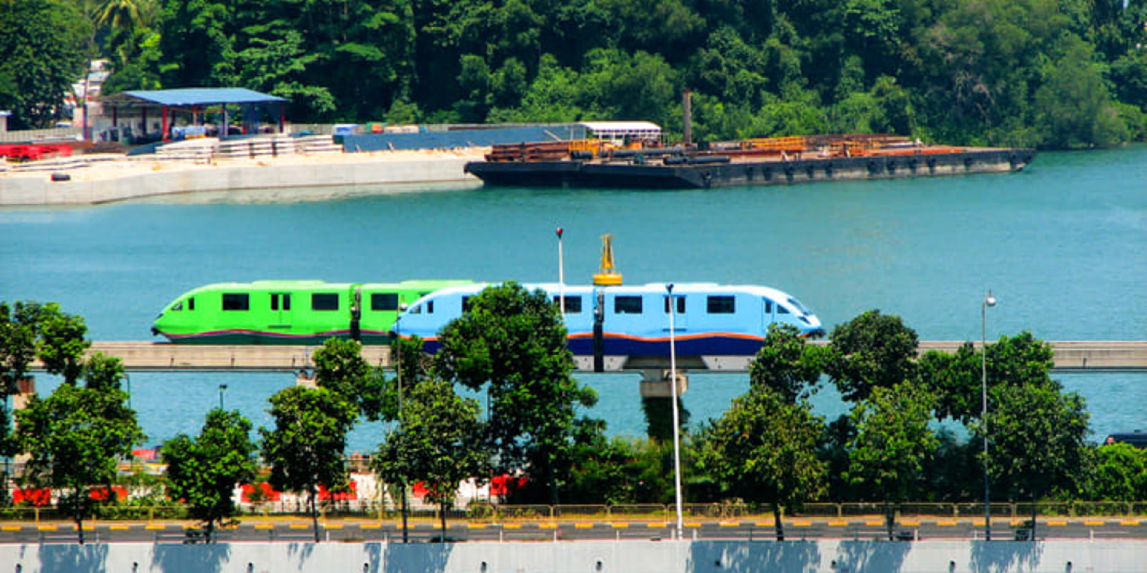 Two Sentosa Express monorail trains passing each other on Sentosa island 