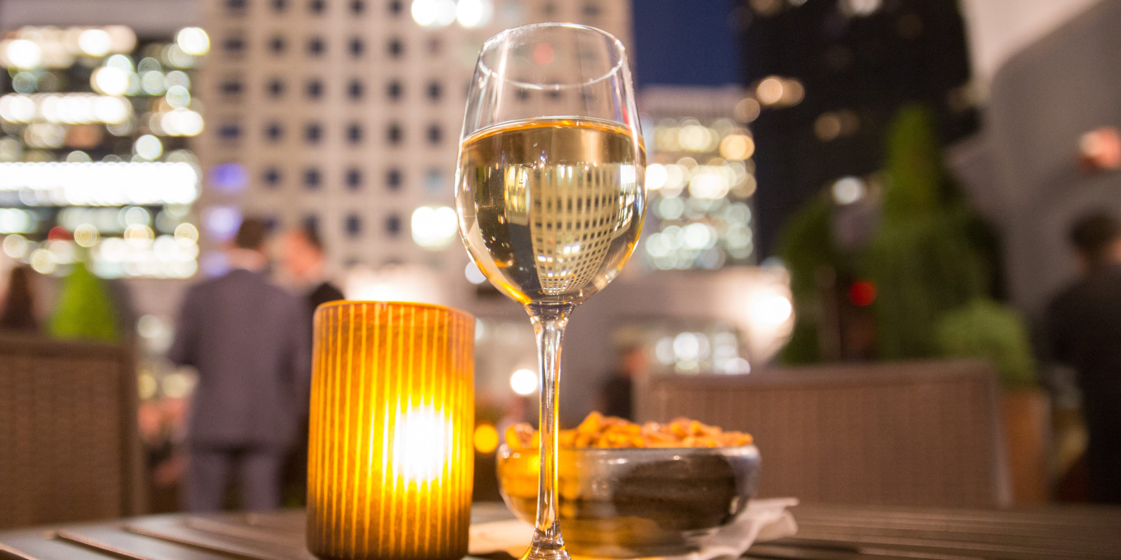 glass of wine on a rooftop bar in nyc
