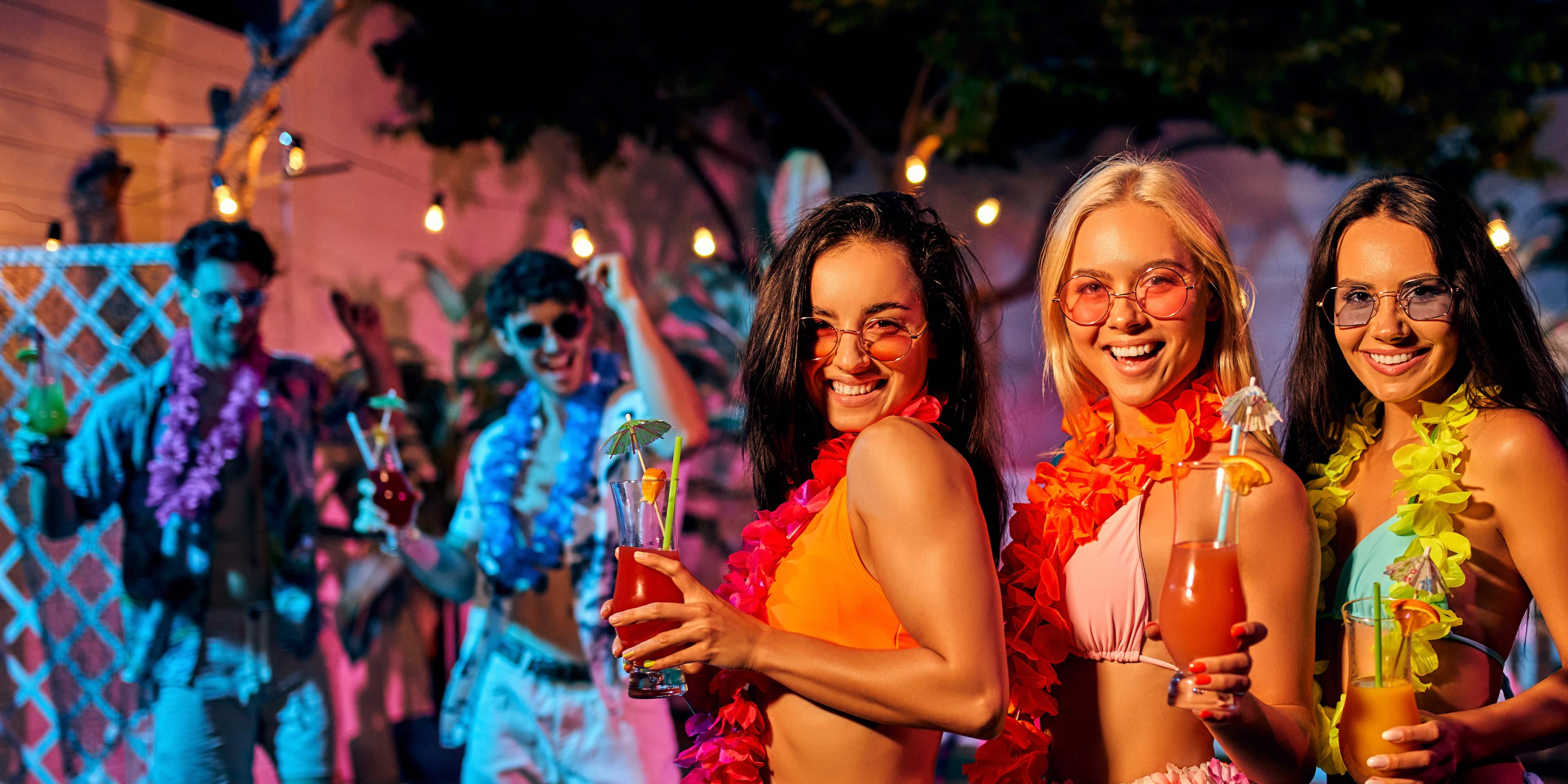 group of friends enjoying a night out in hawaii