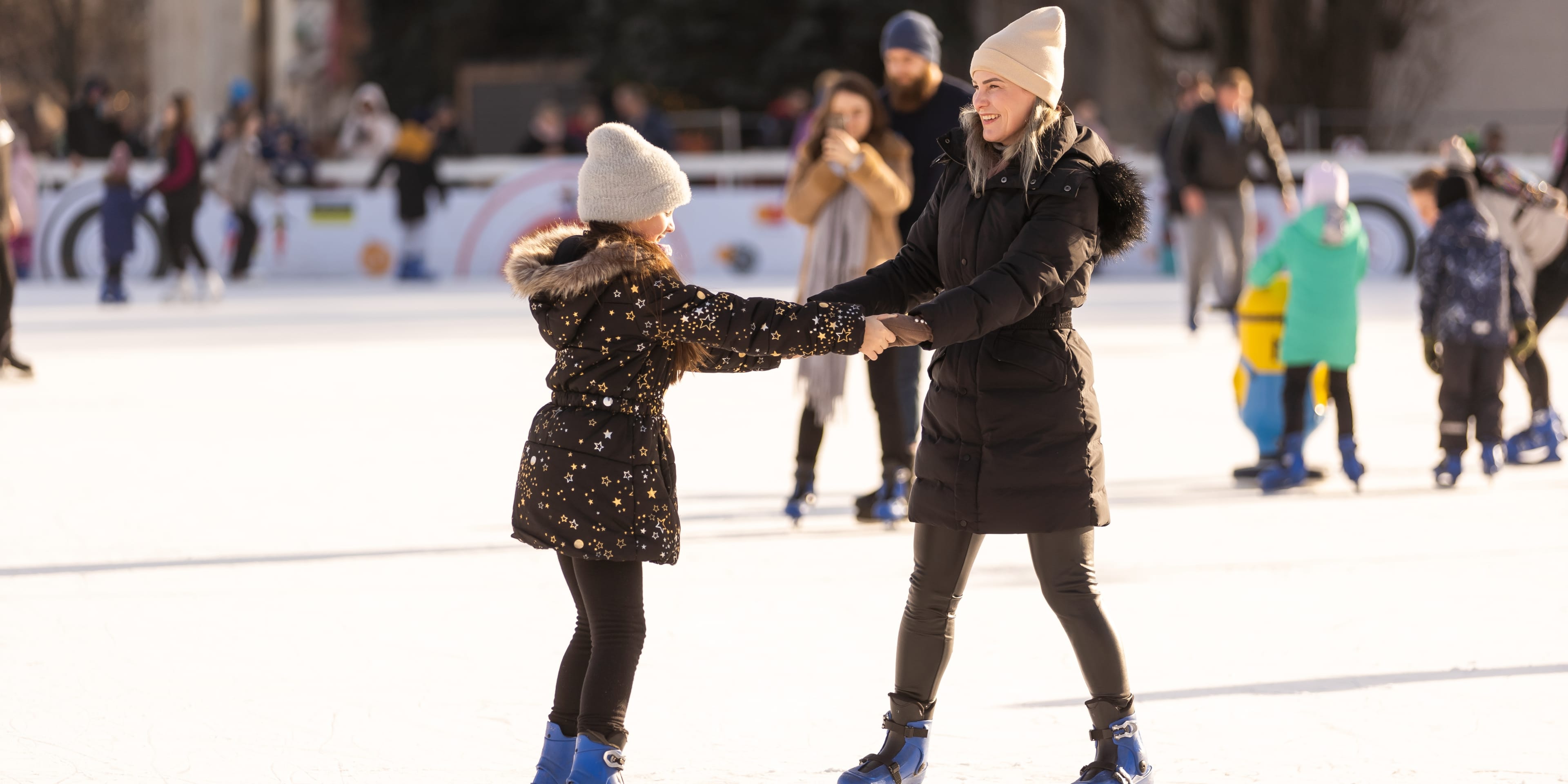 ice skating mother and daughter in NYC over winter