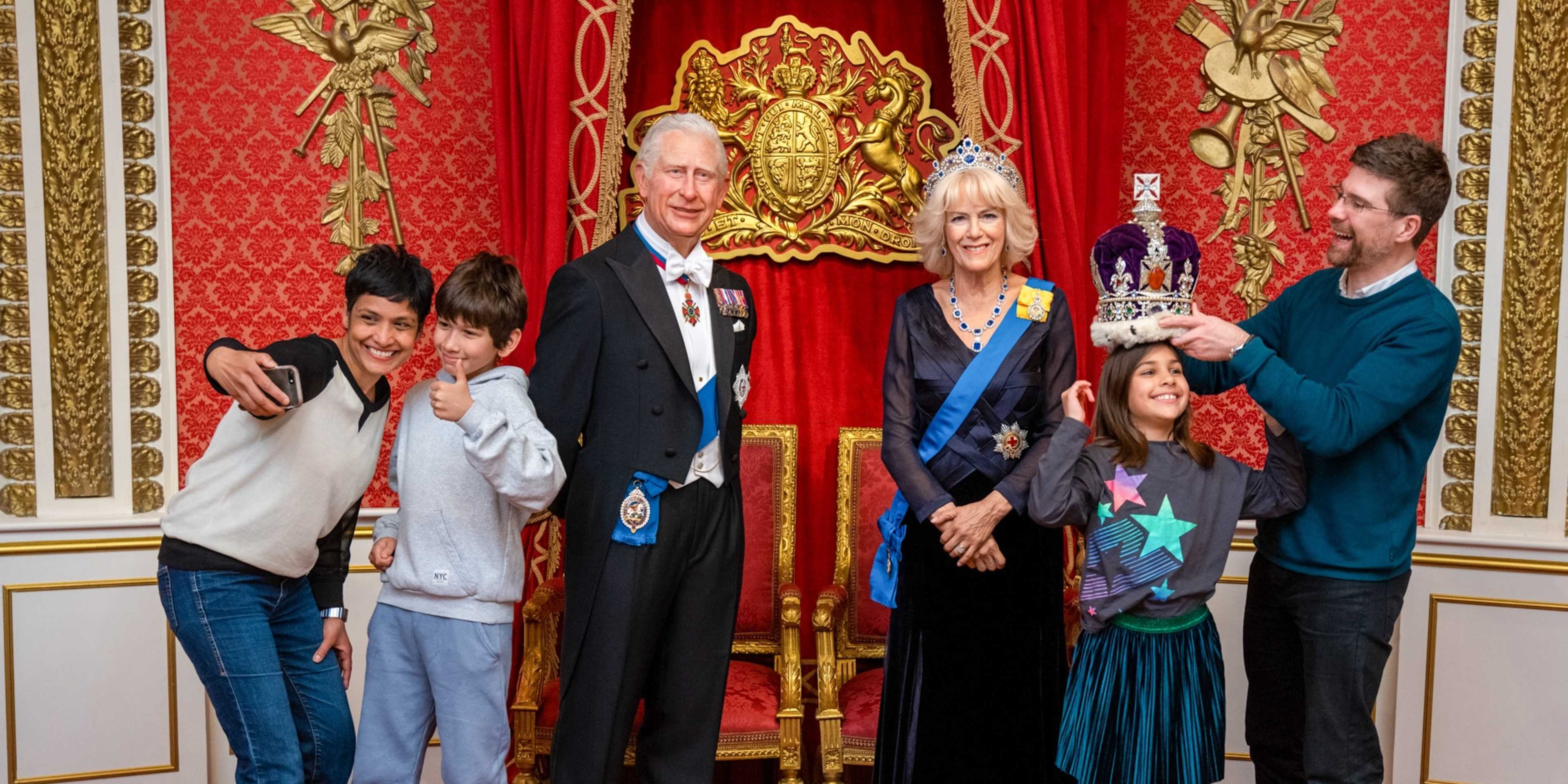 Family Posing with the Royal Family at Madame Tussauds London