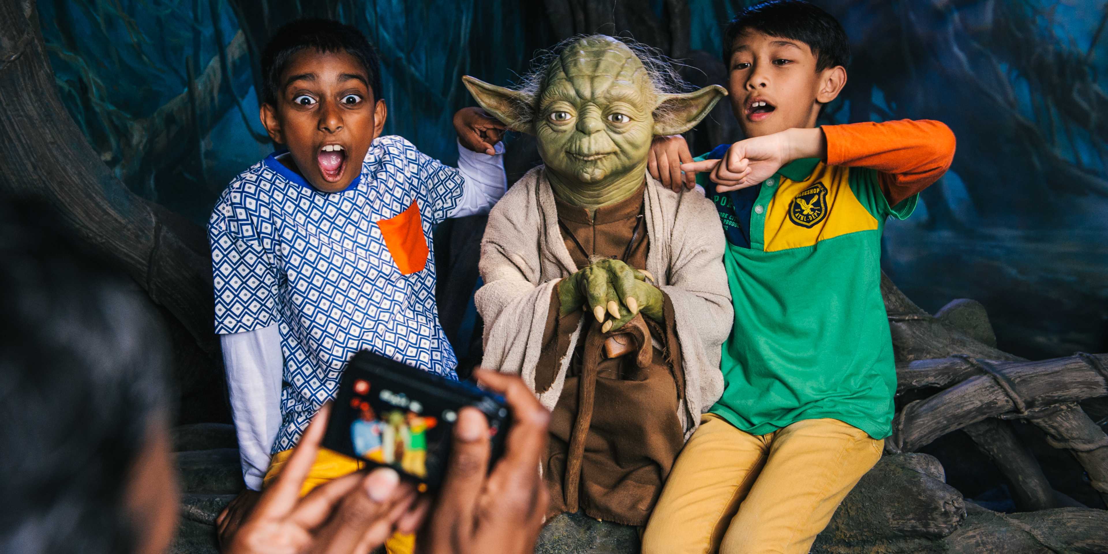 Kids Posing with Yoda at Madame Tussauds London
