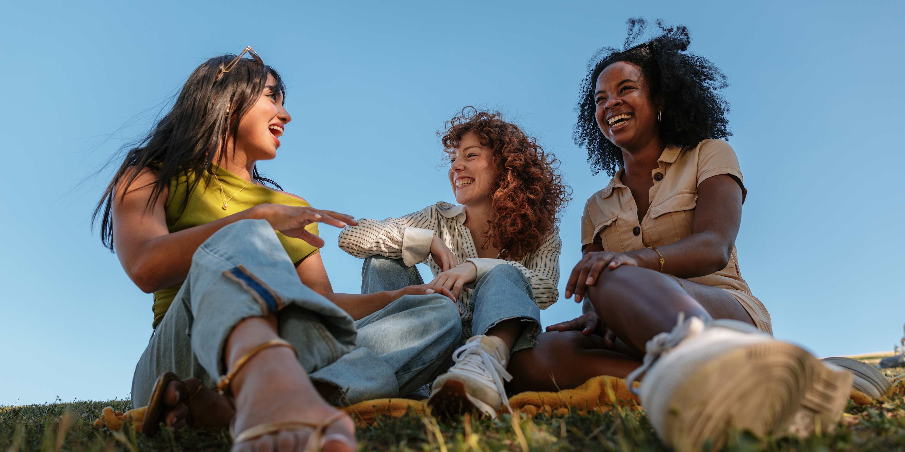 friends laughing in a sunny park