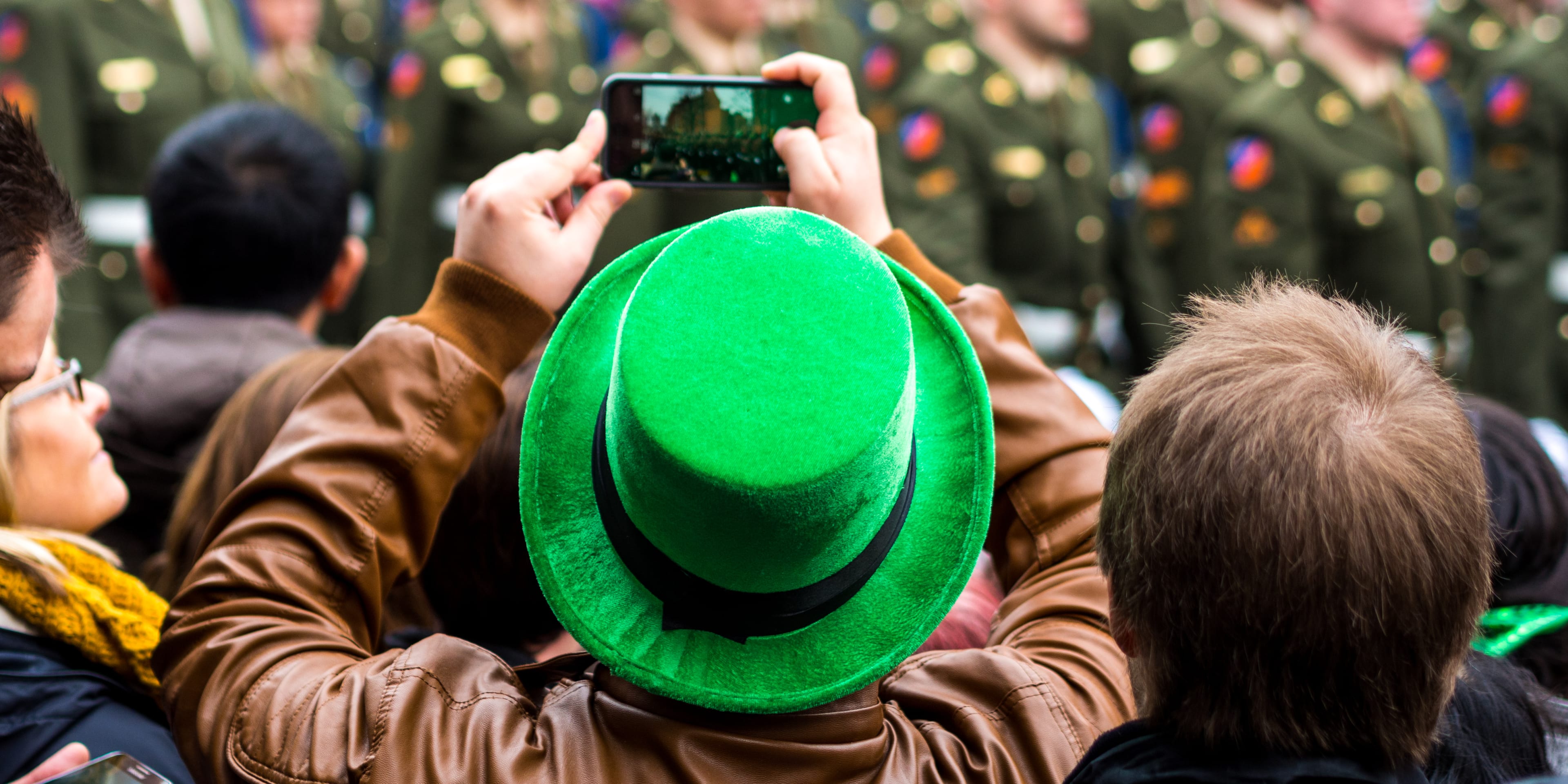 Man taking photo at St Patrick's Day parade, Dublin