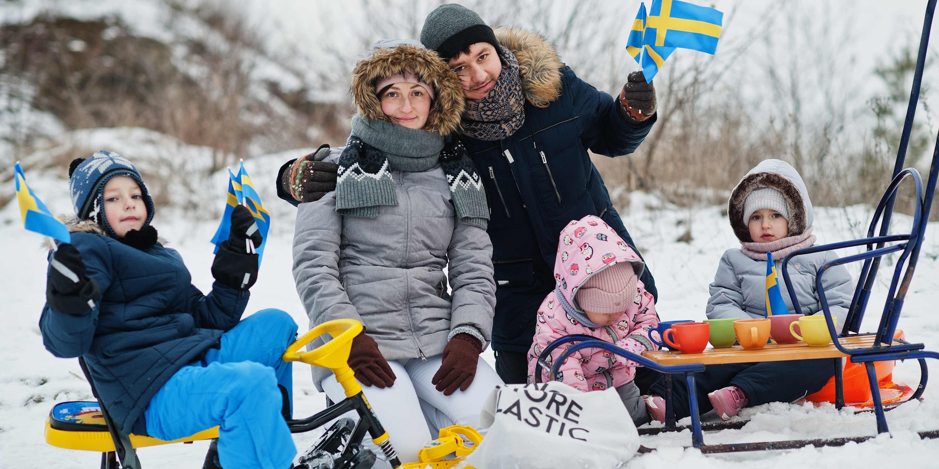 family enjoying snowy stockholm