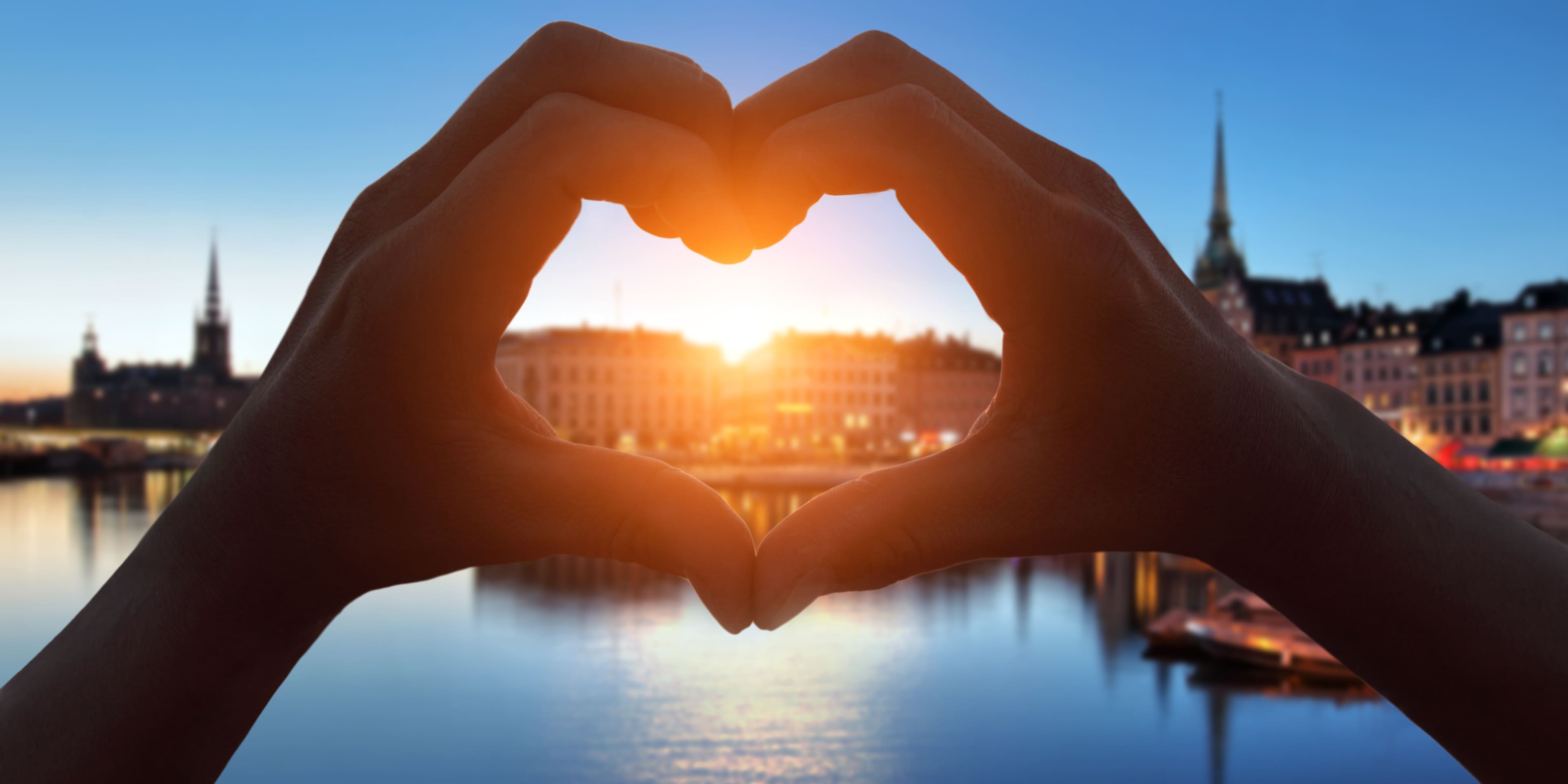 hands making a heart over stockholm