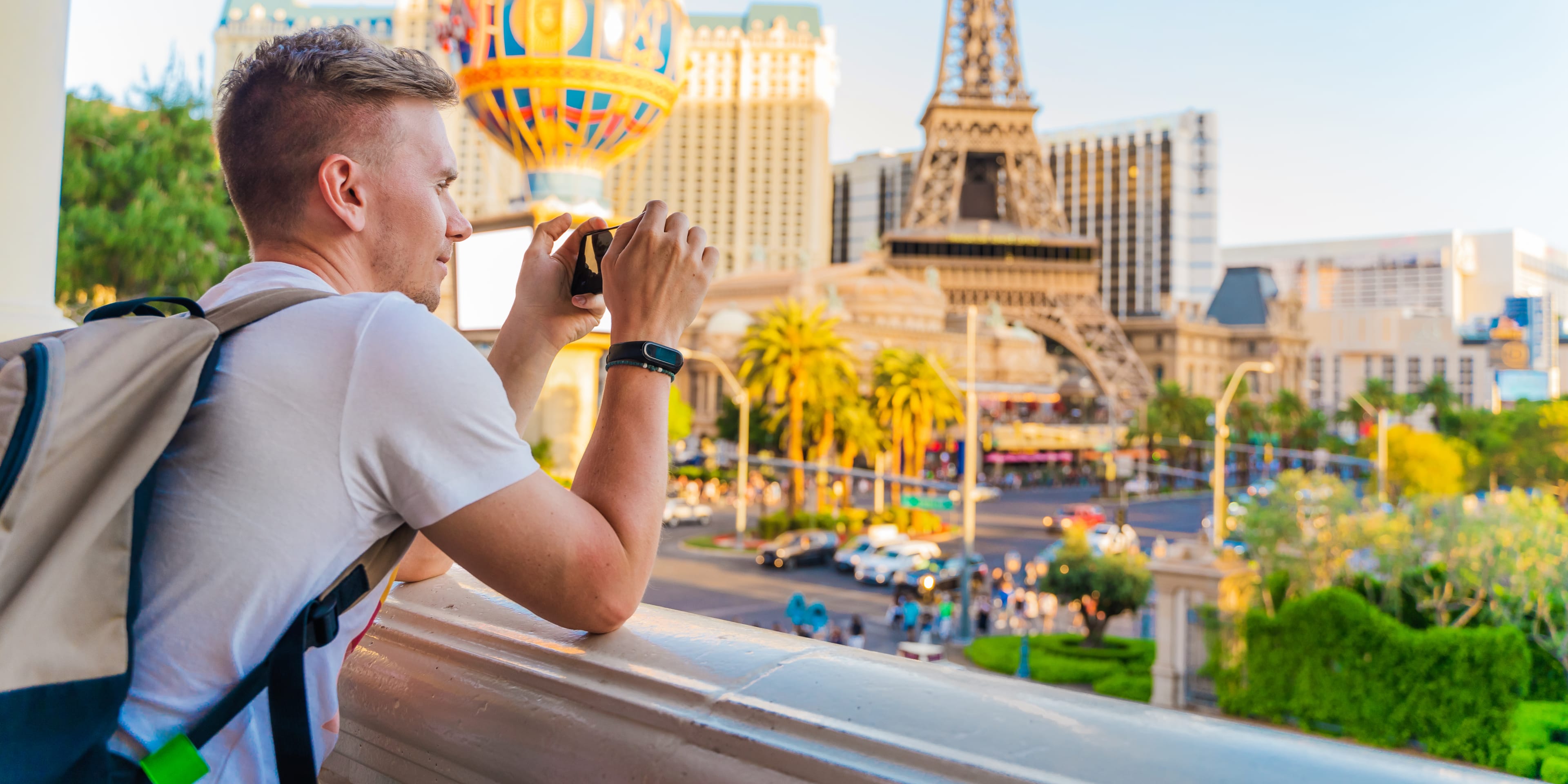 traveler photographing vegas during a sunny day