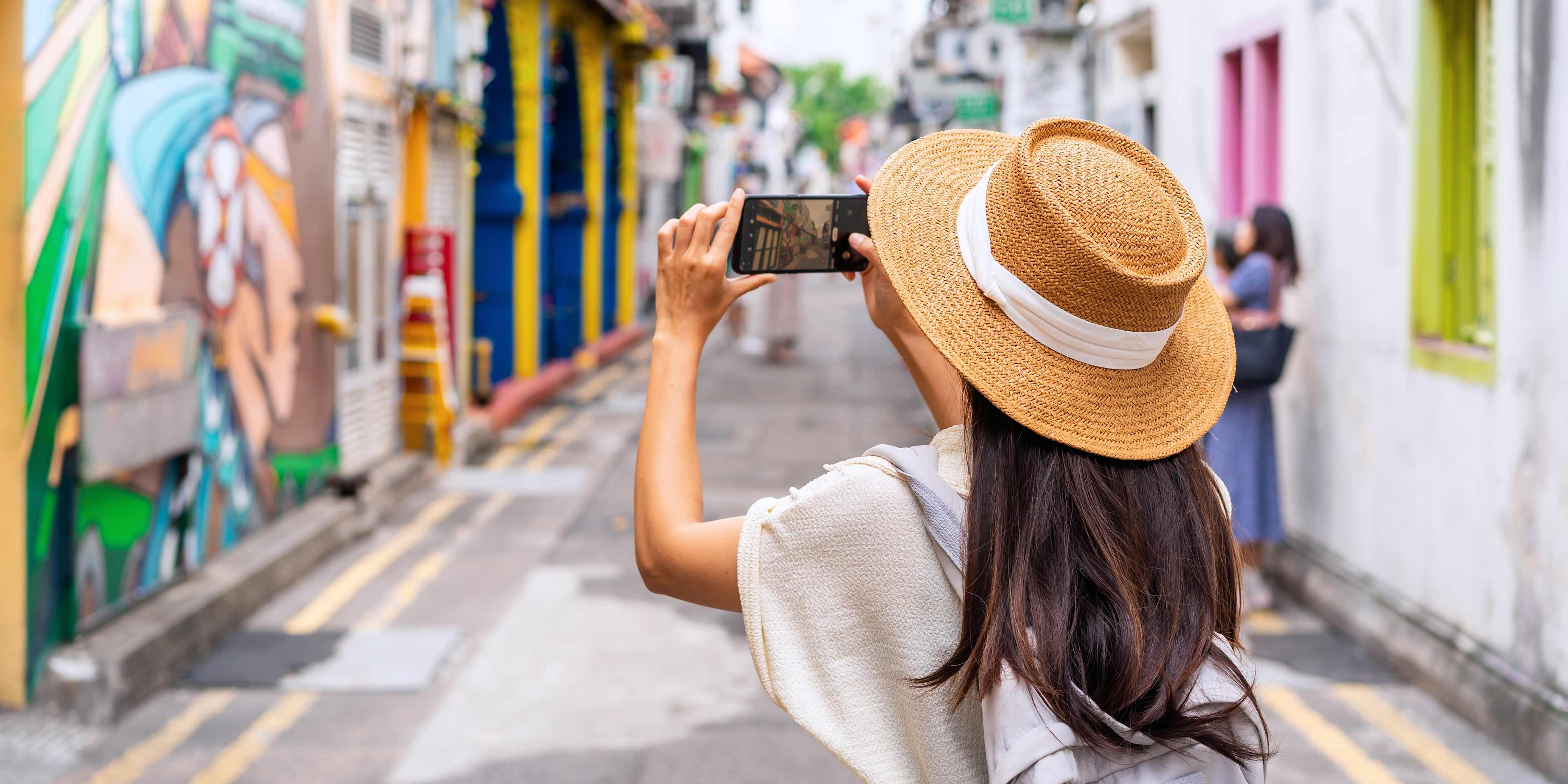 Woman Taking a Photo in Haji Lane
