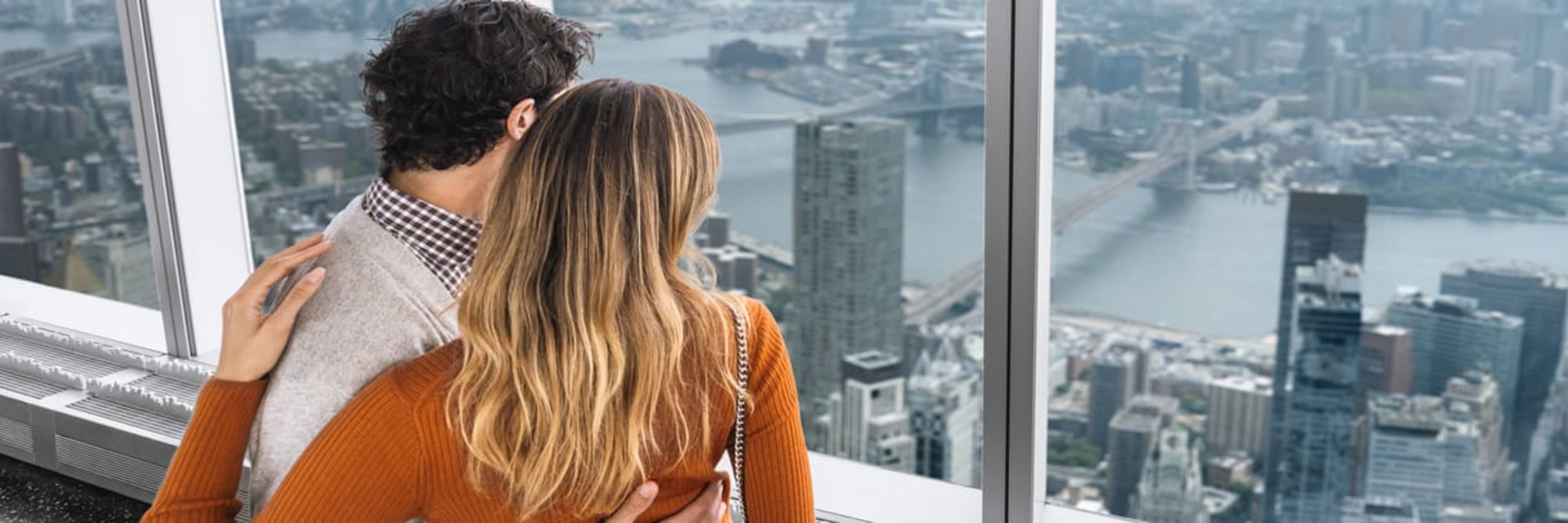 One world observatory couple looking out