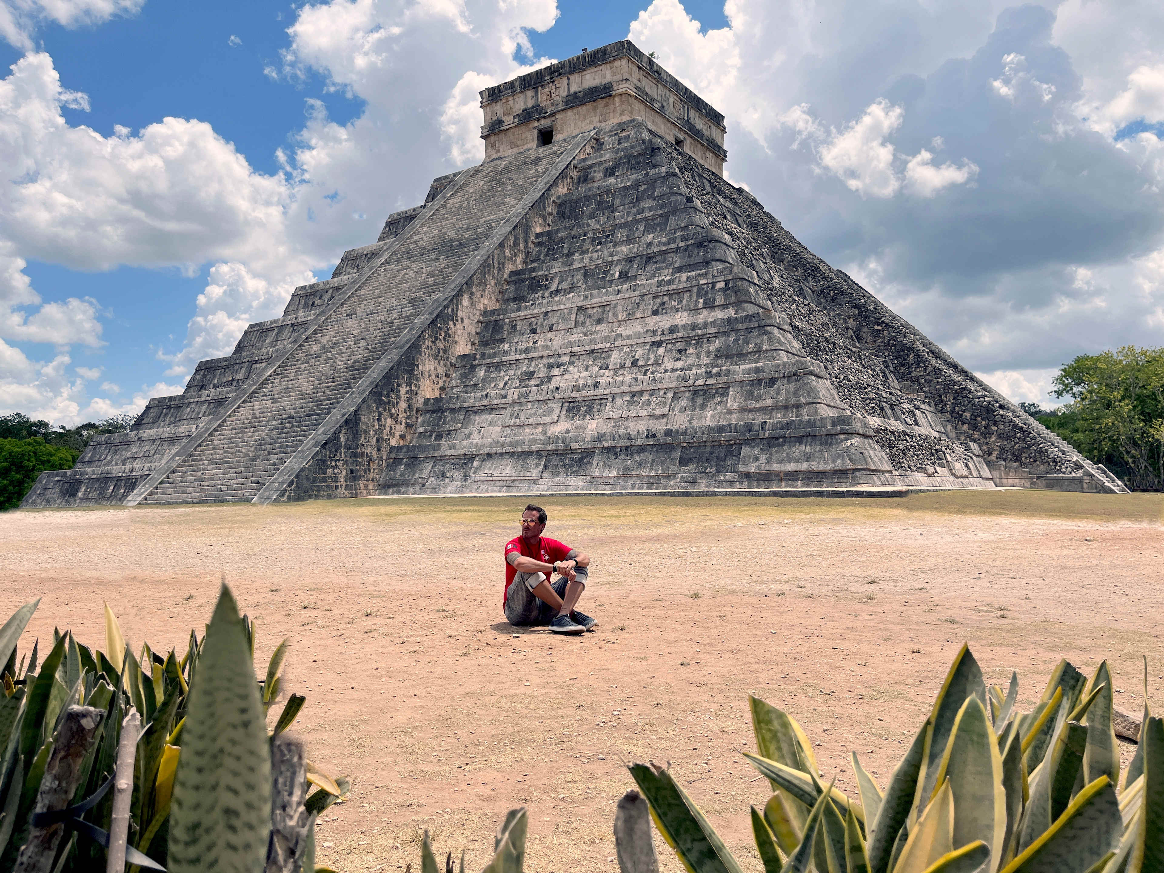 Man Sat in Front of Chichen Itza Temple Pyramid