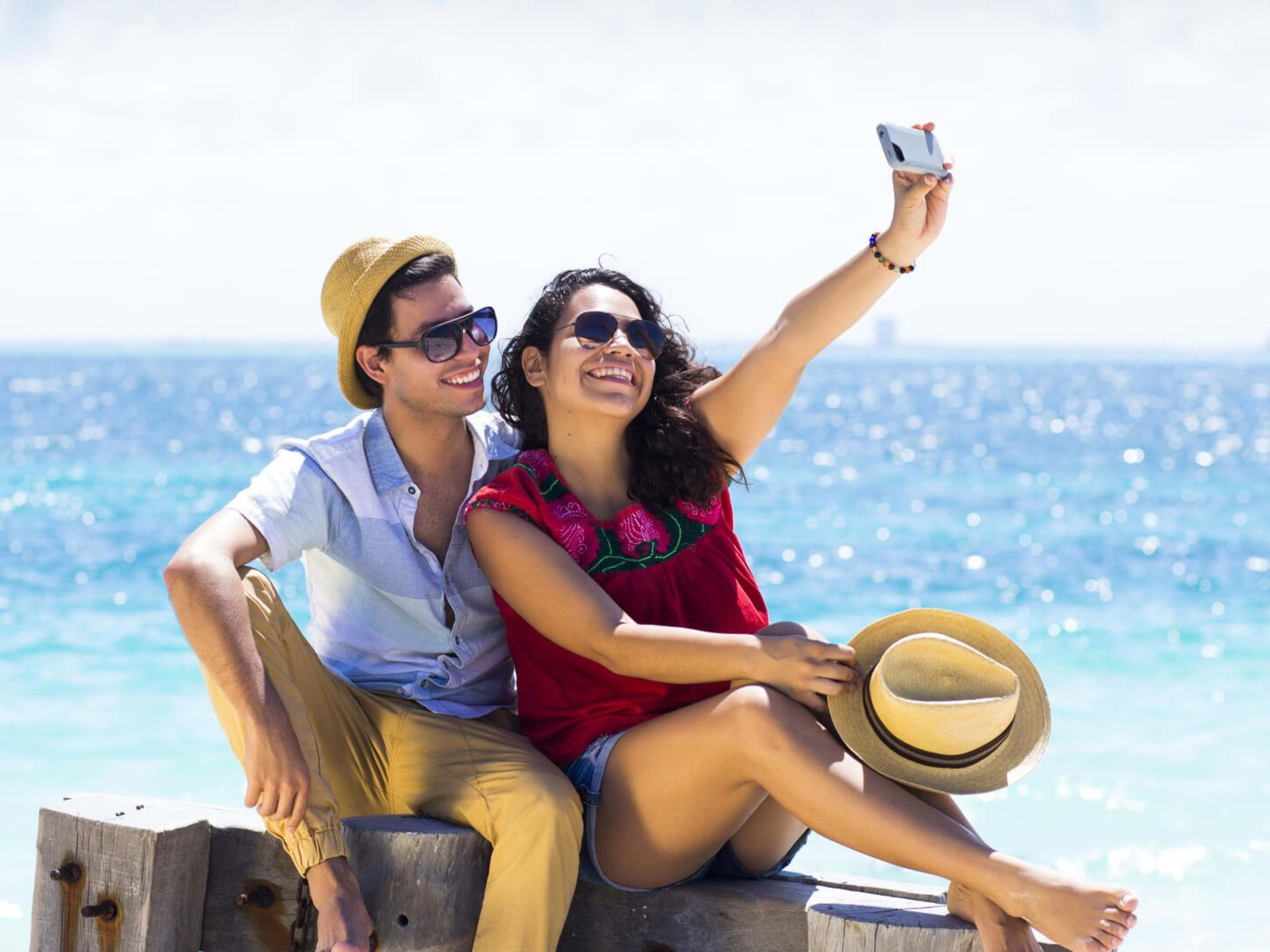 A couple enjoy the beach at Cancun