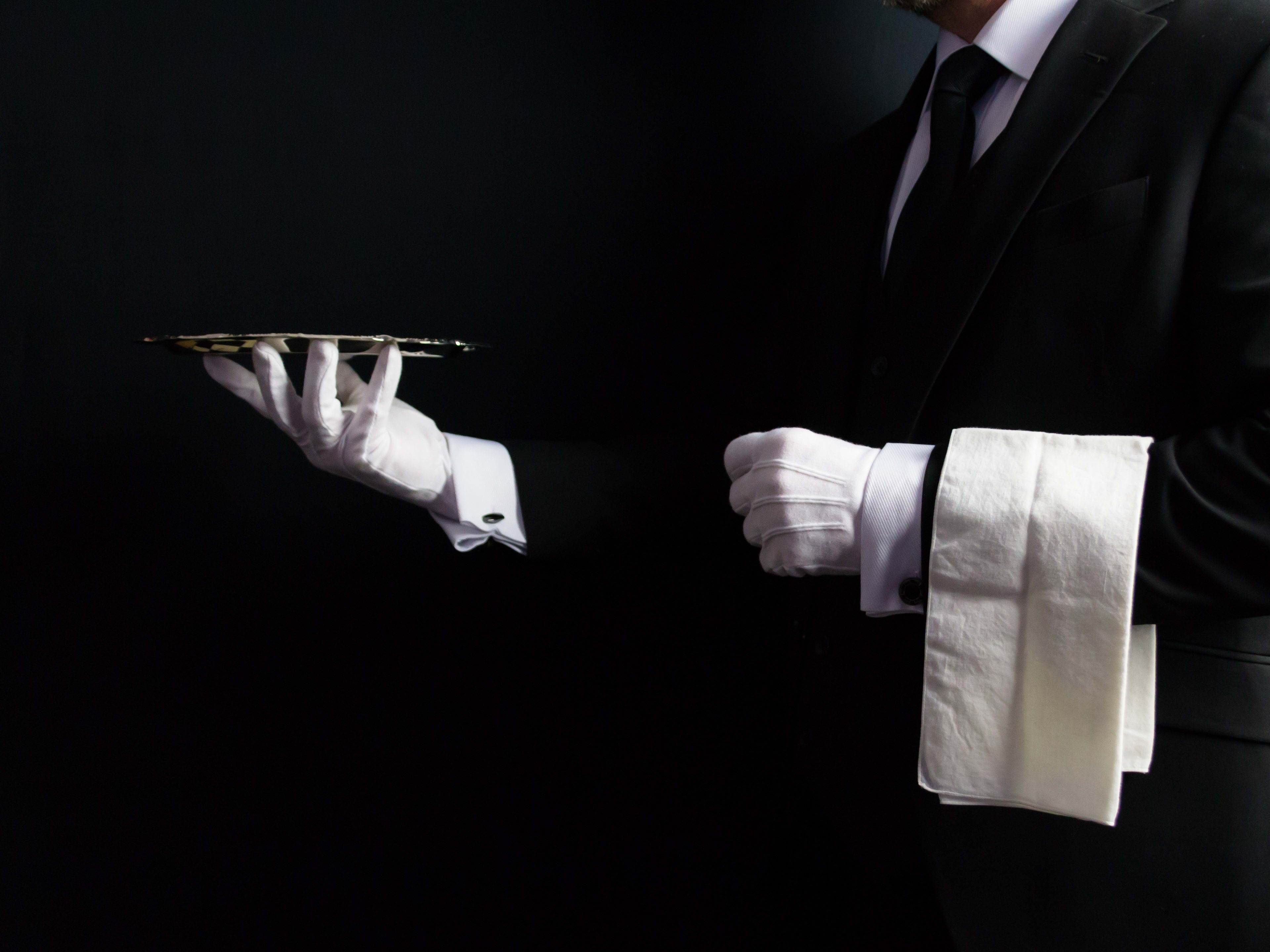 Butler in white gloves