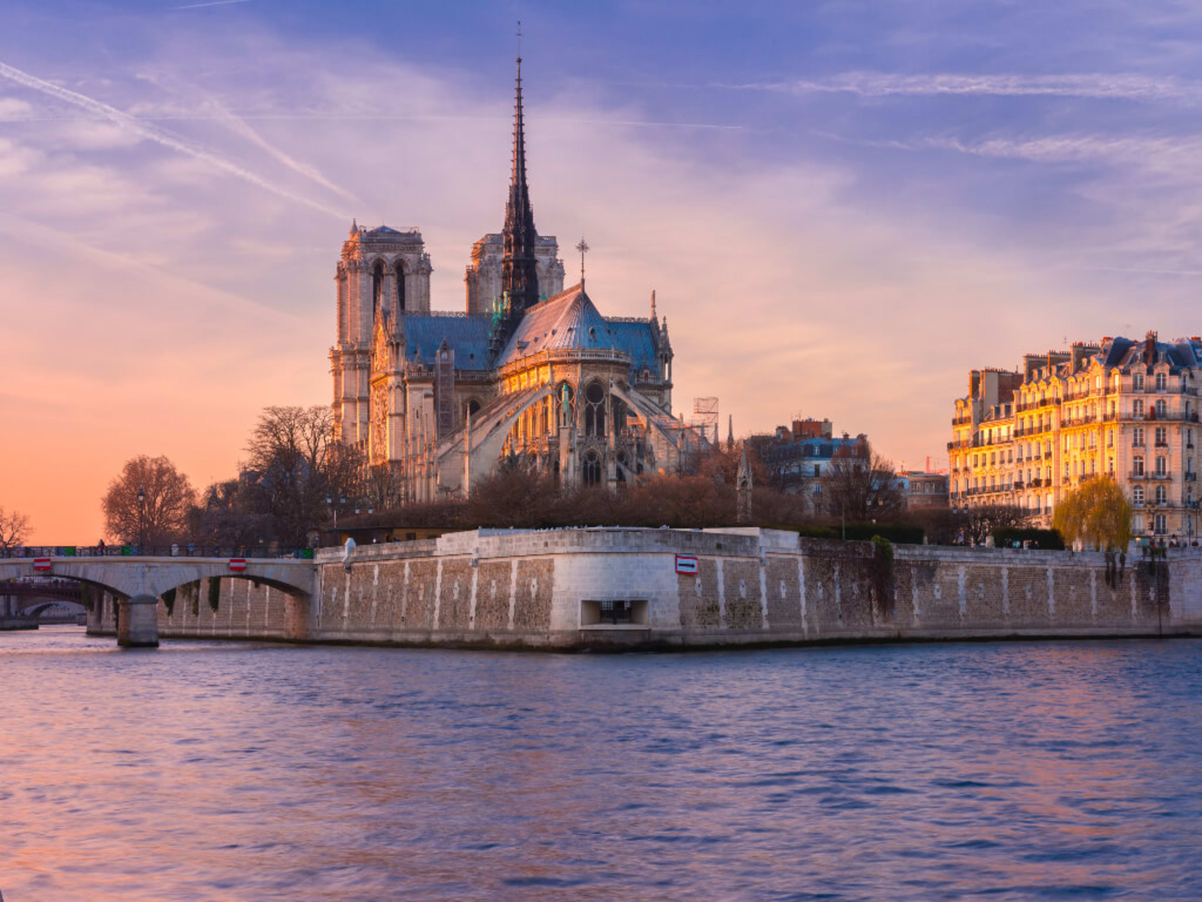 Sun sets behind Notre Dame Cathedral