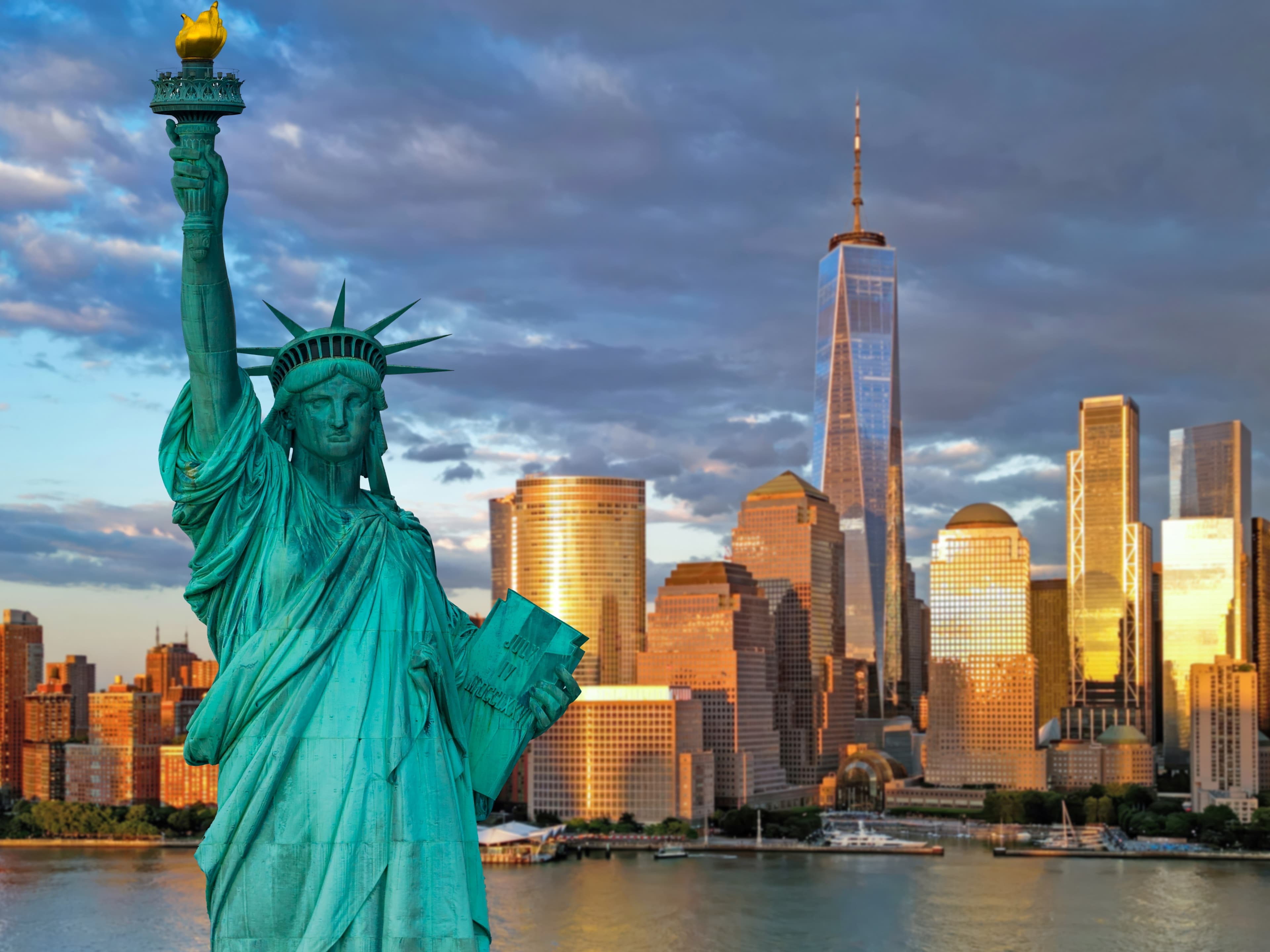 beautiful shot of the nyc skyline with lady liberty in the foreground