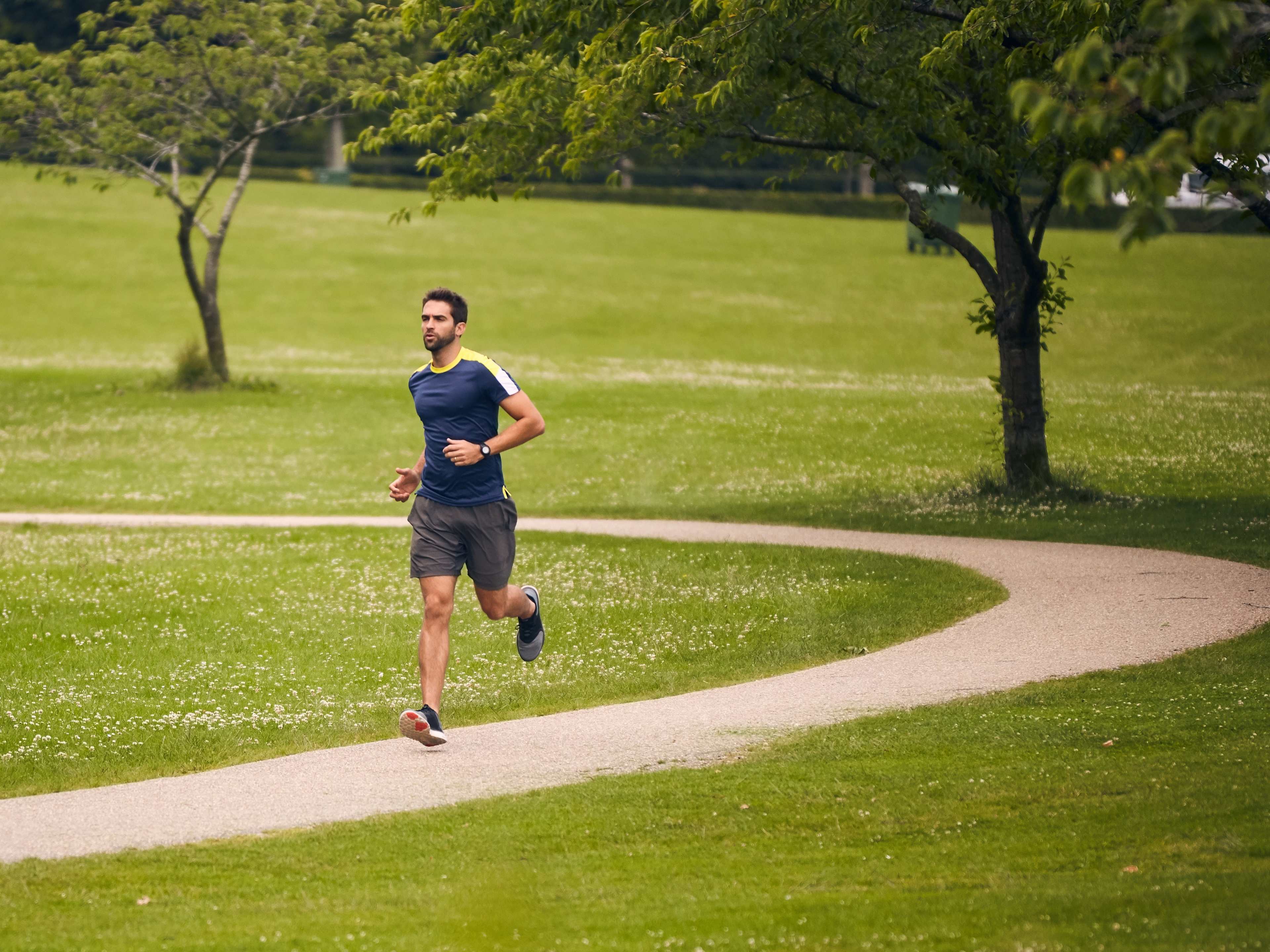 man running through a park