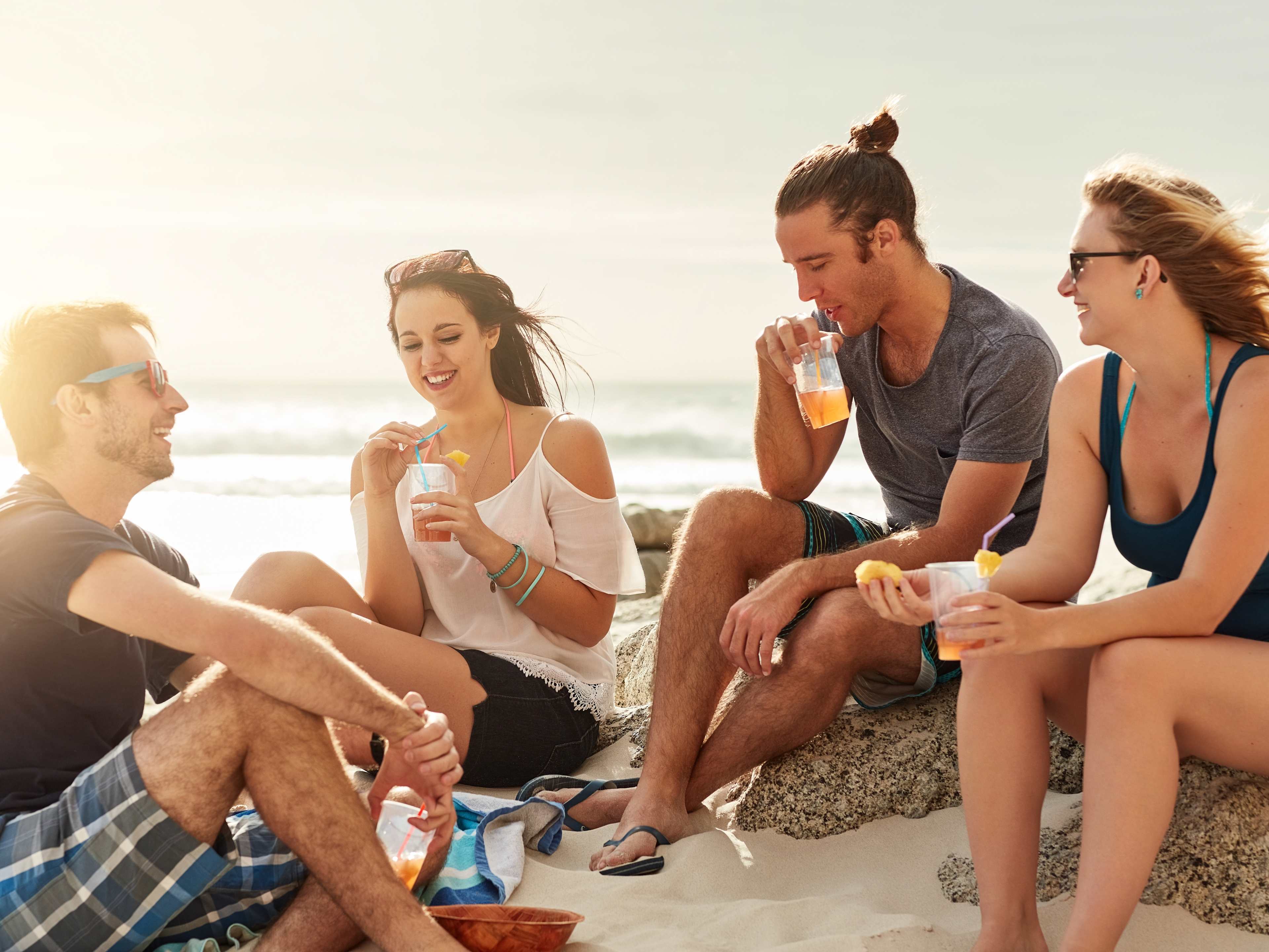 Friends Having a Picnic on the Beach