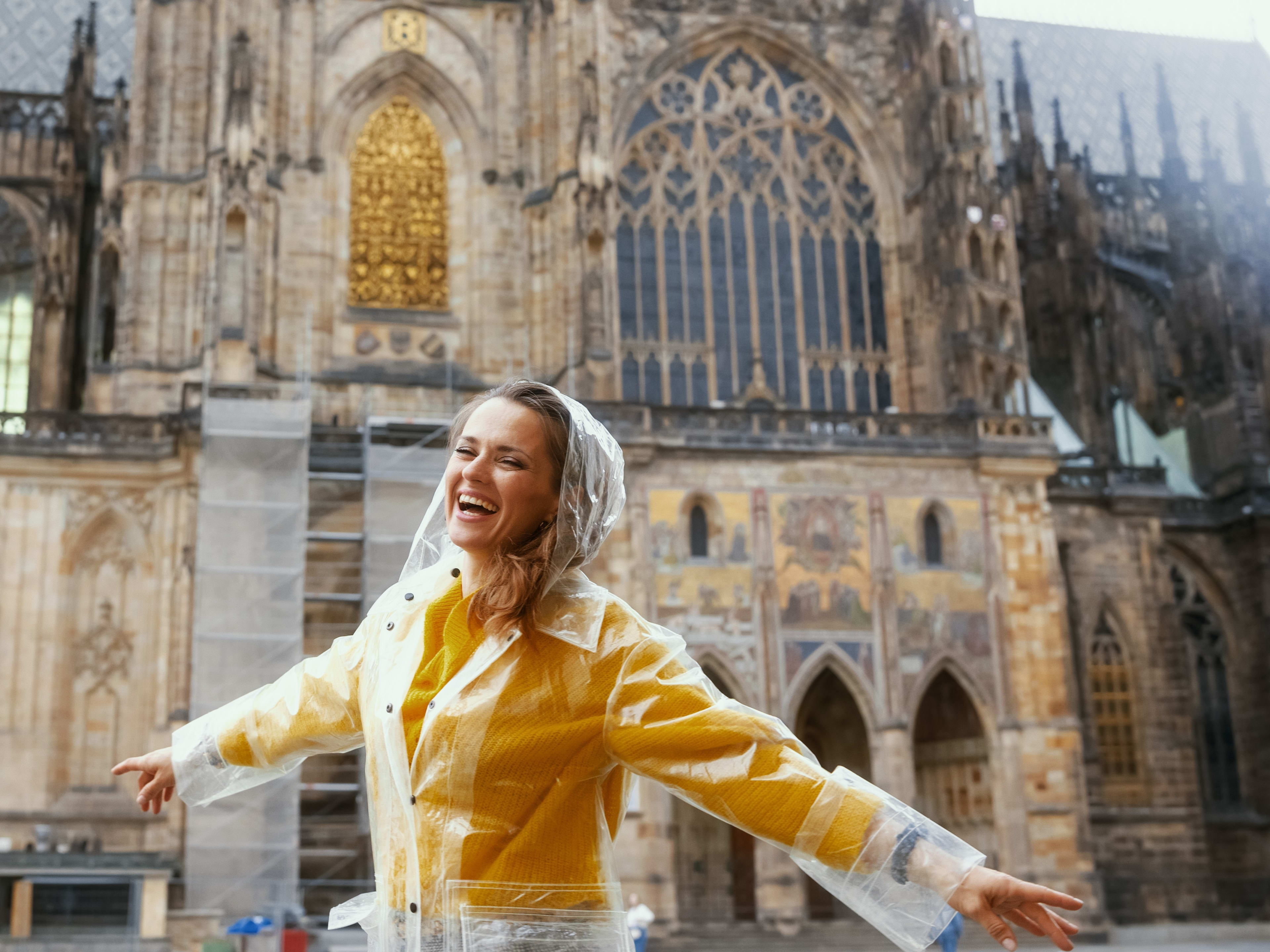 Woman in raincoat in Prague