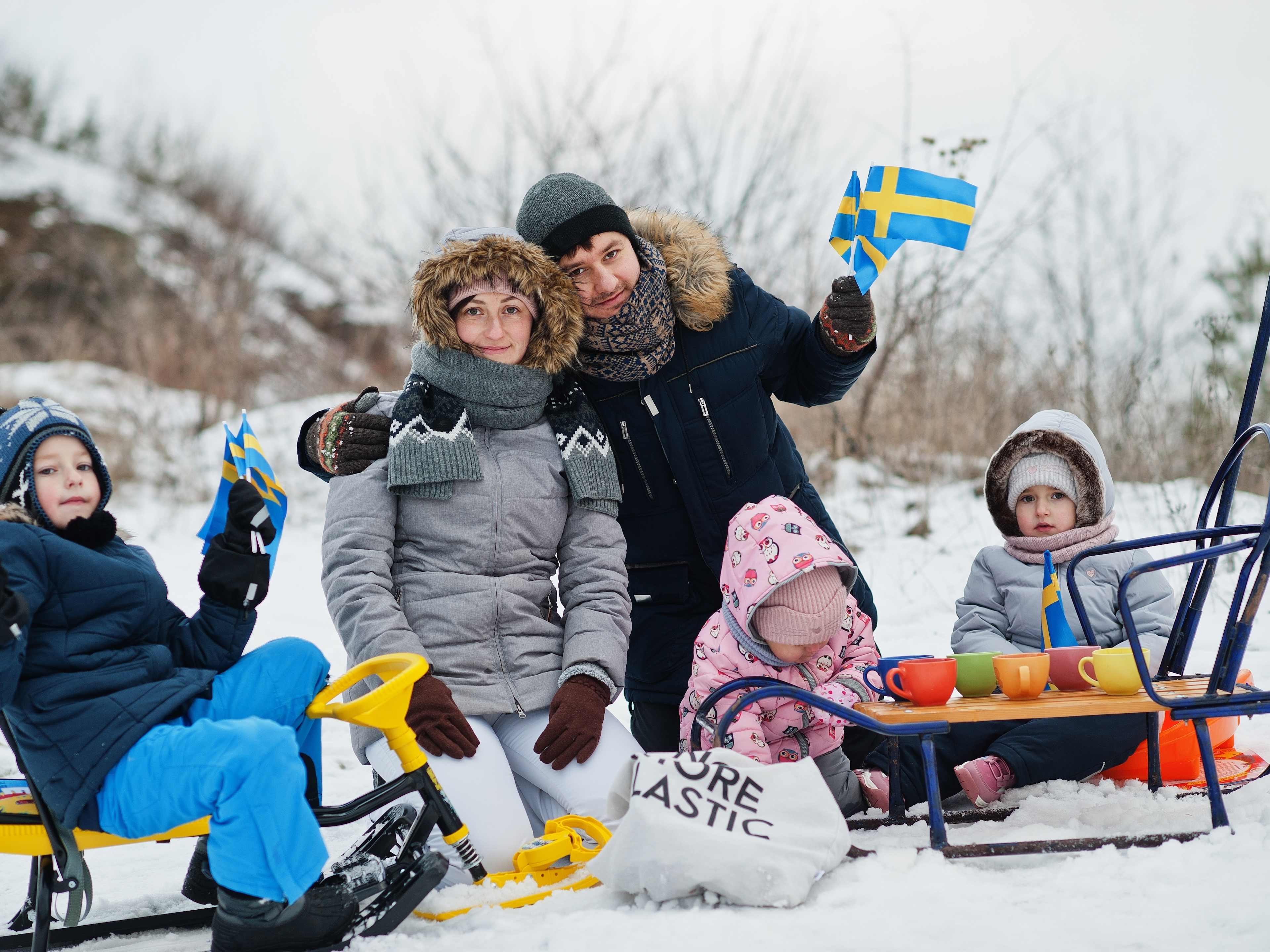 family enjoying snowy stockholm