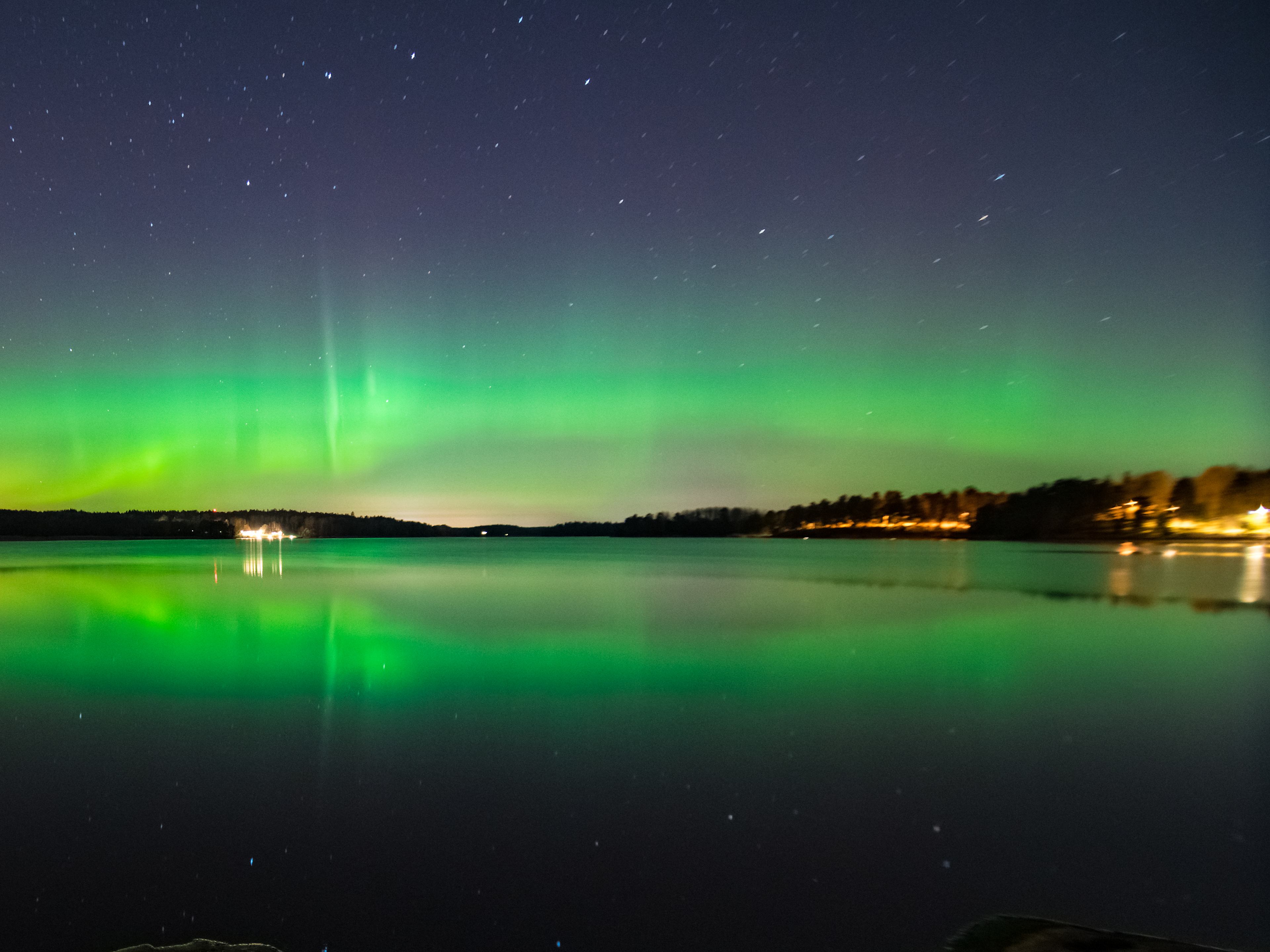 the aurora borealis over the night sky in stockholm