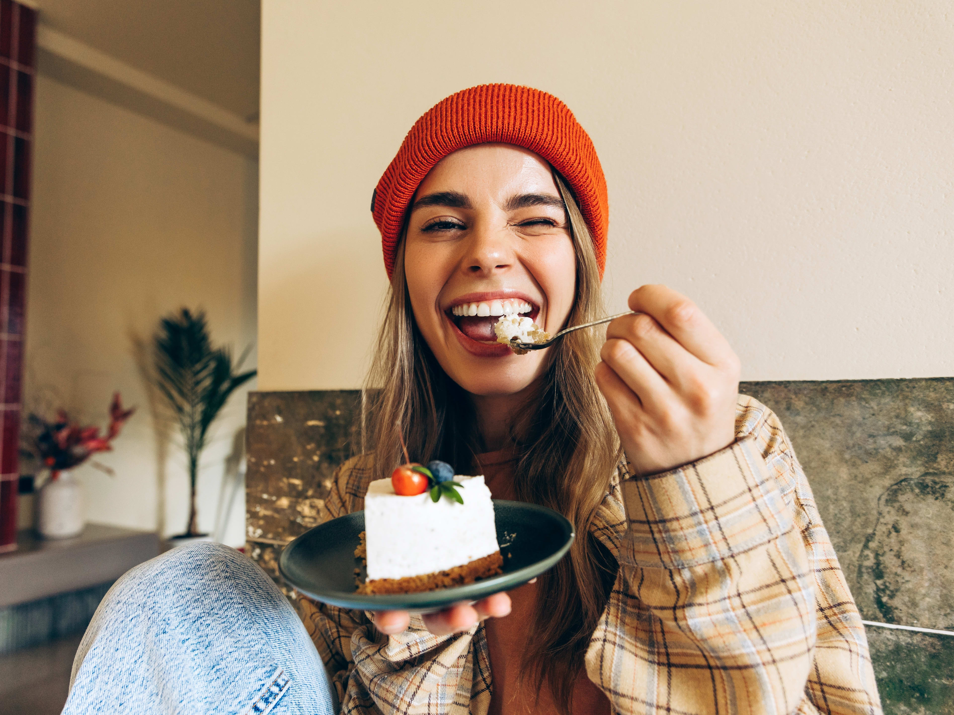 woman enjoying a cake