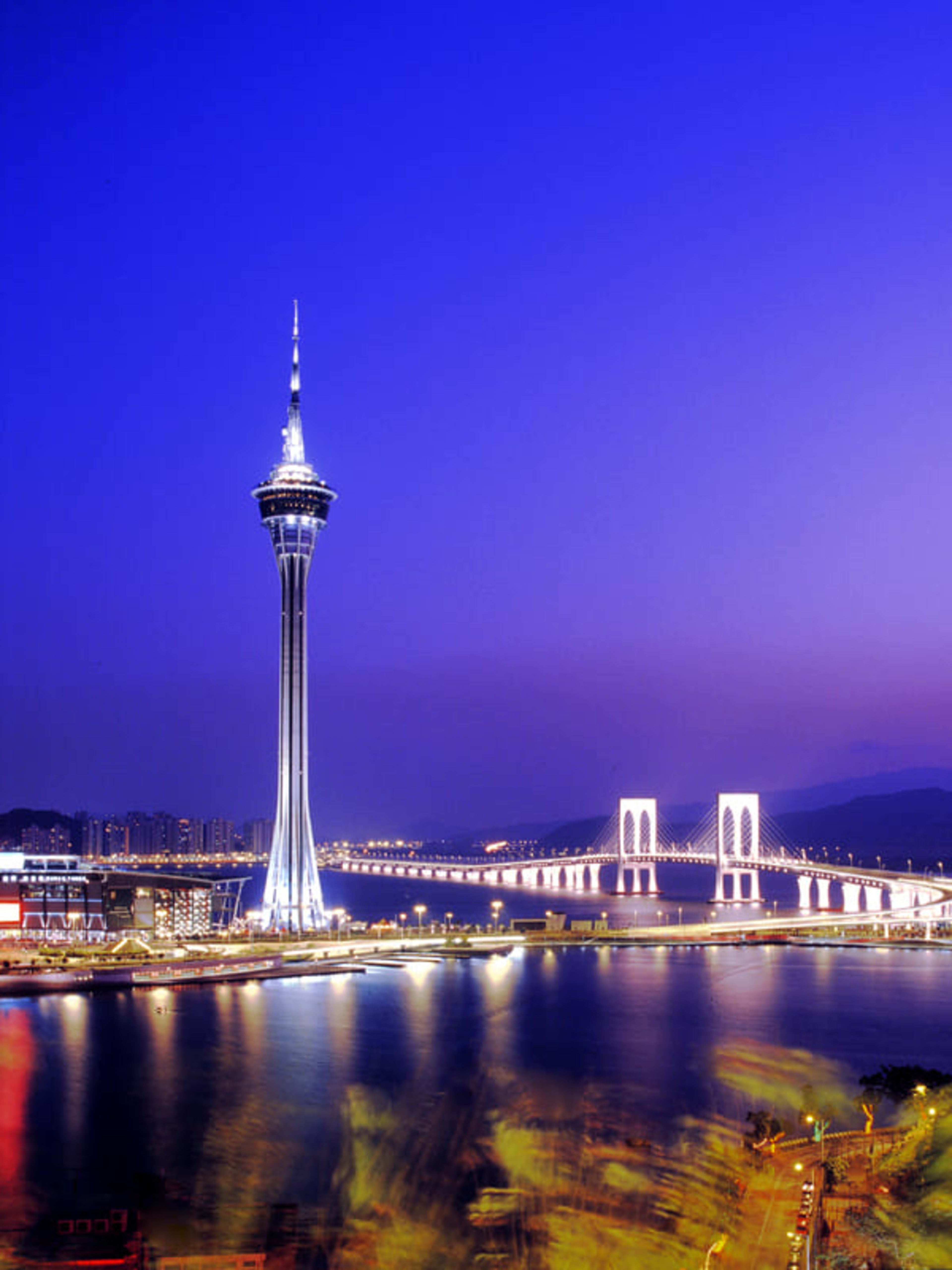 Macau Tower and the city skyline by night.