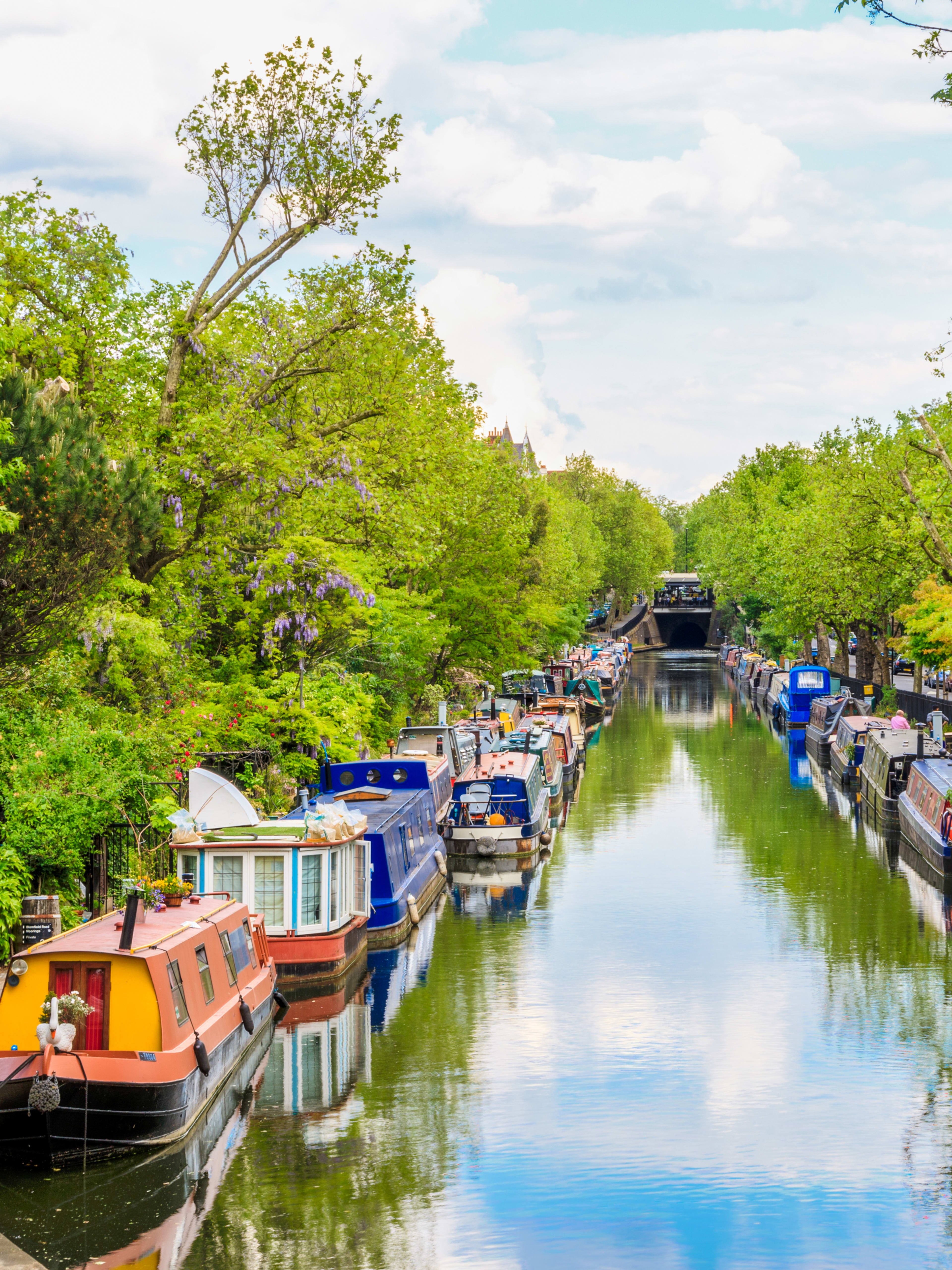 Colorful barges moored along Regent's Canal.