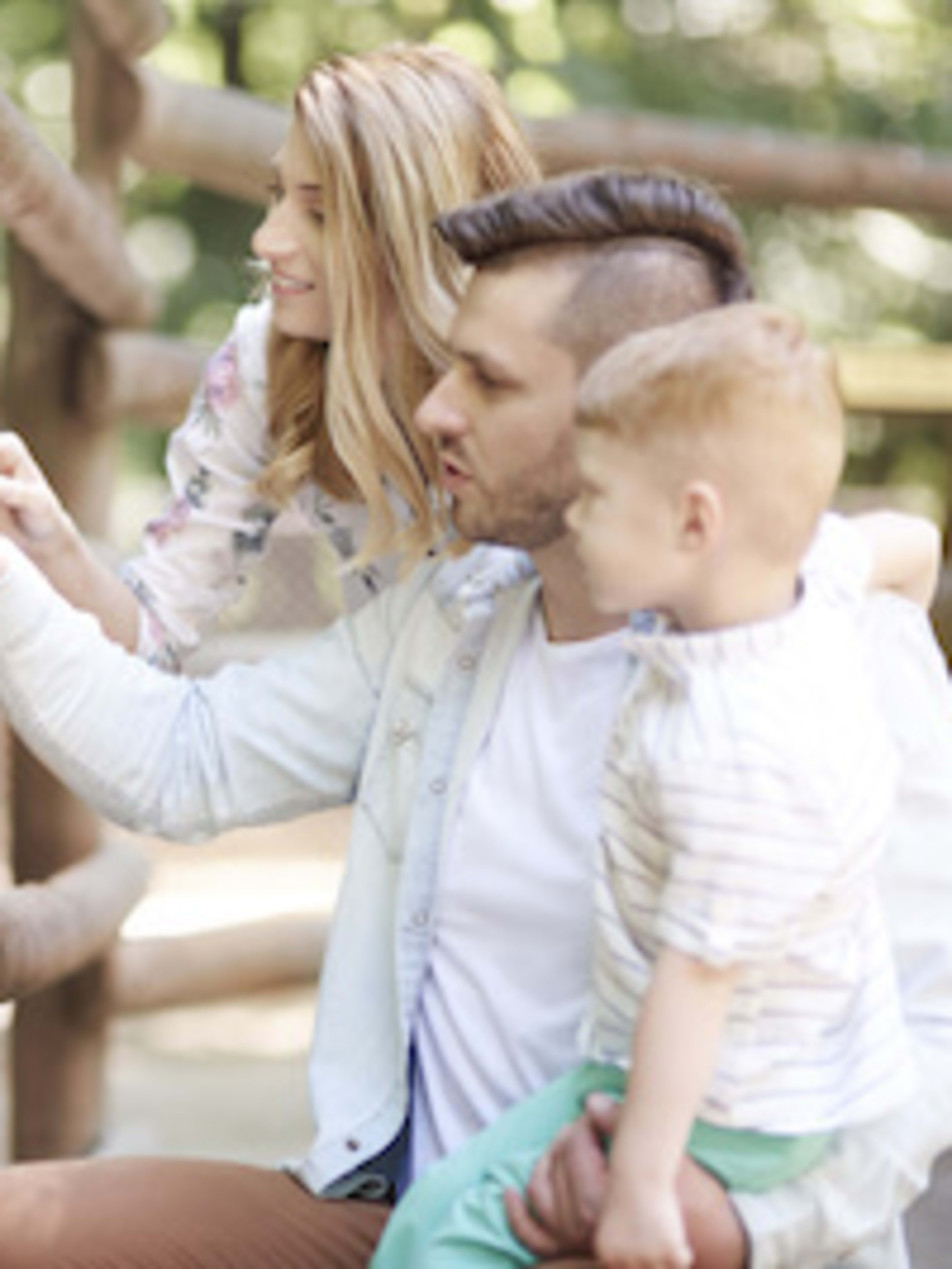 Family petting a horse