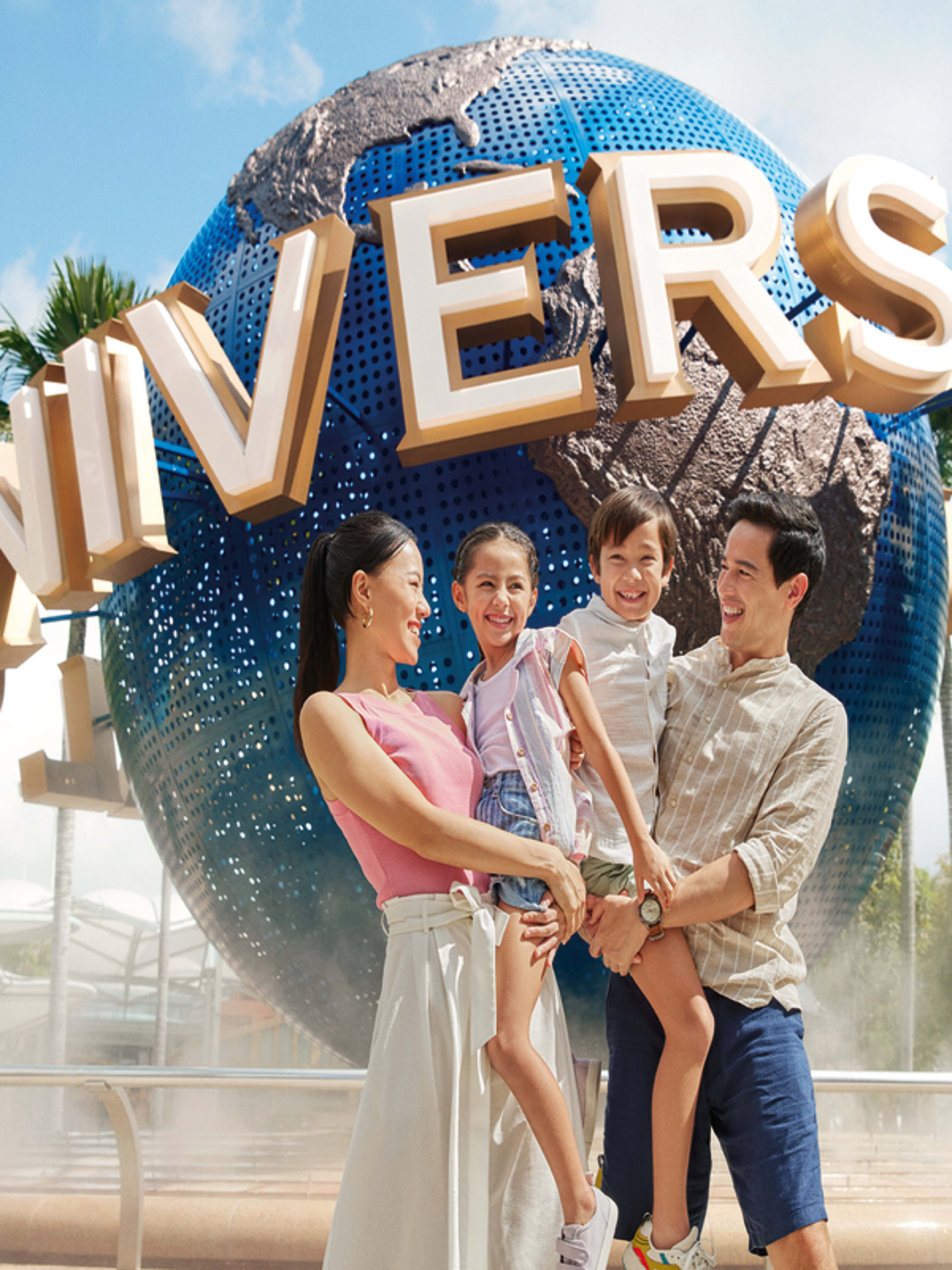 Family infront of universal sign