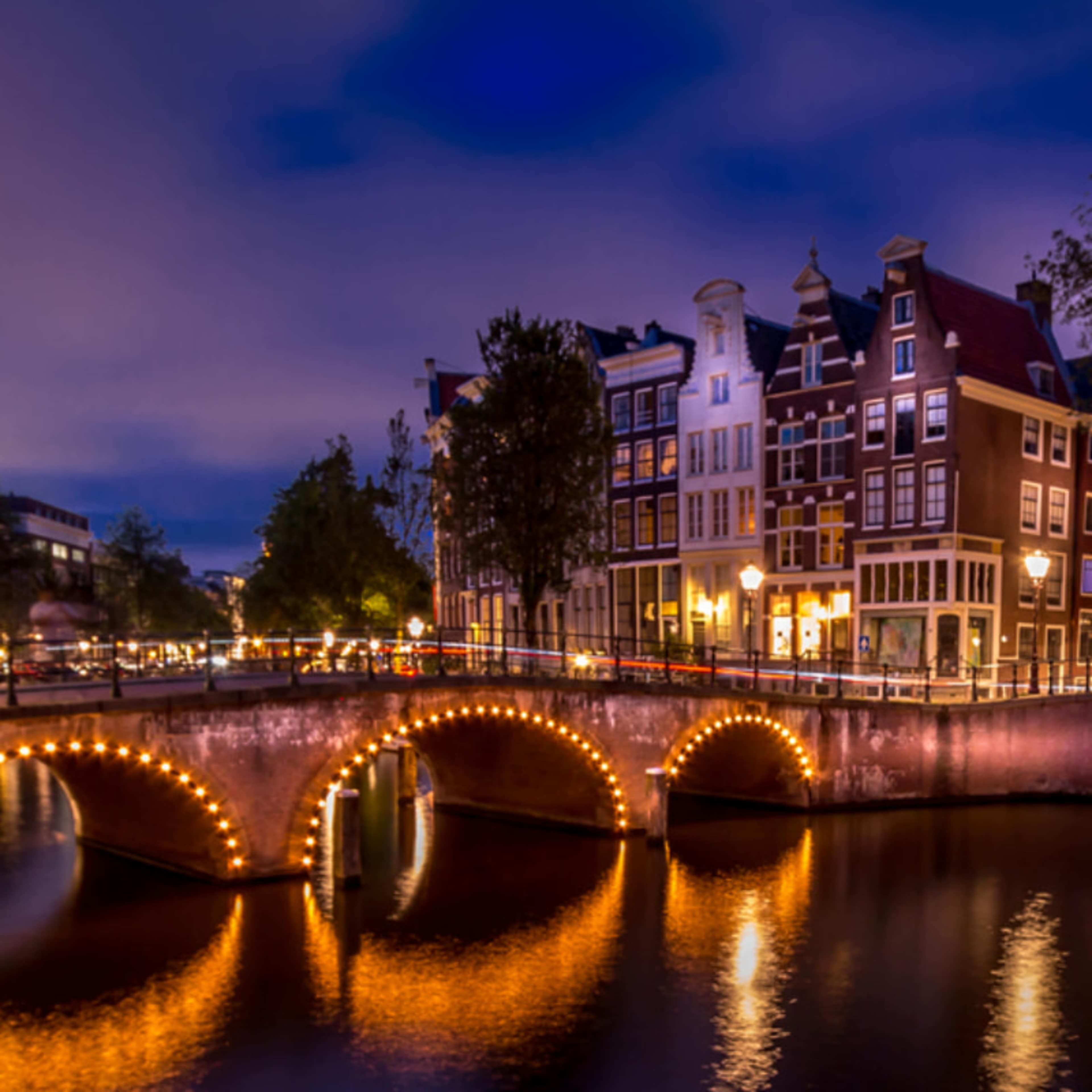 Bridge in Amsterdam illuminated at night