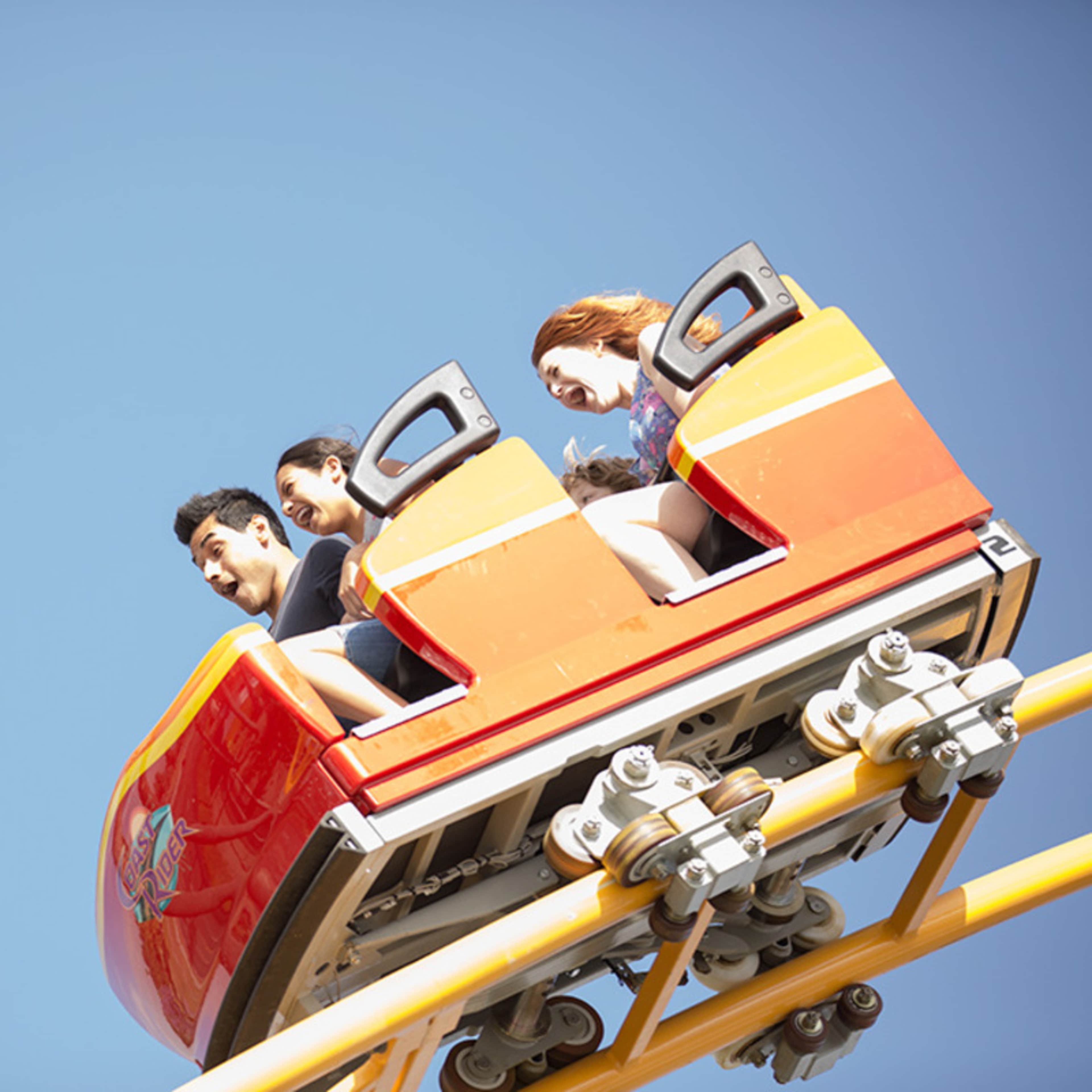 Riders aboard the Coast Rider at Knott's Berry Farm, LA.
