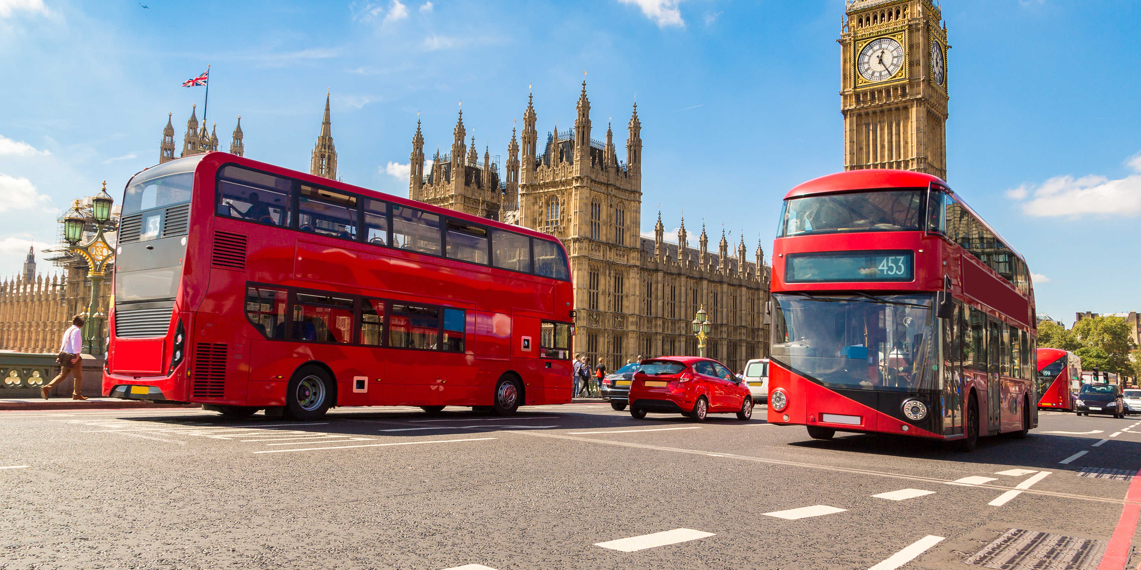 London buses driving past Parliament