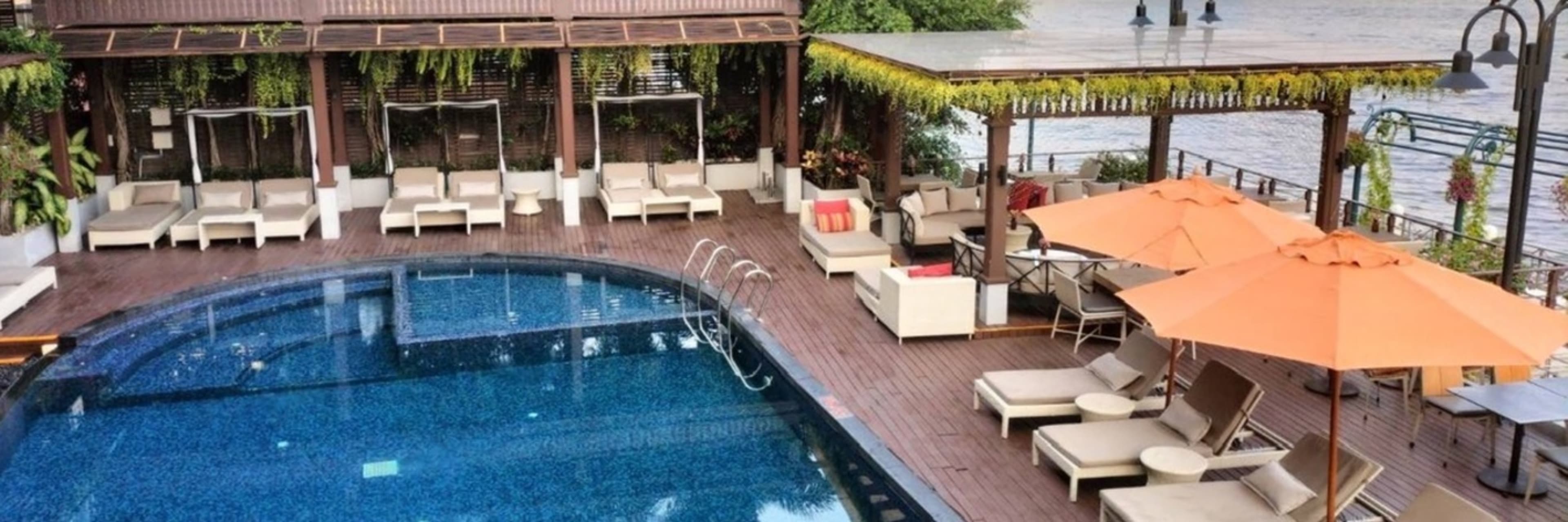 Riva Surya Pool Access with Drinks or Foot Massage 