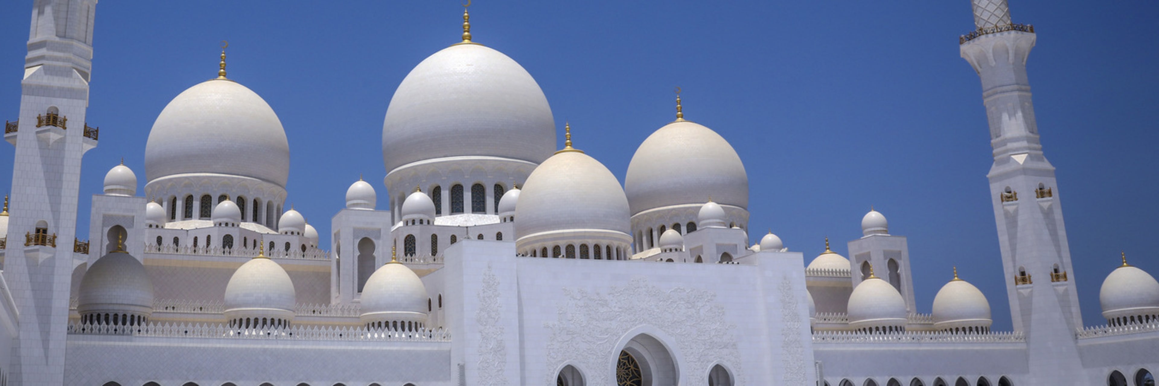 Minarets and domes at the Sheikh Zayed Grand Mosque in Abu Dhabi.