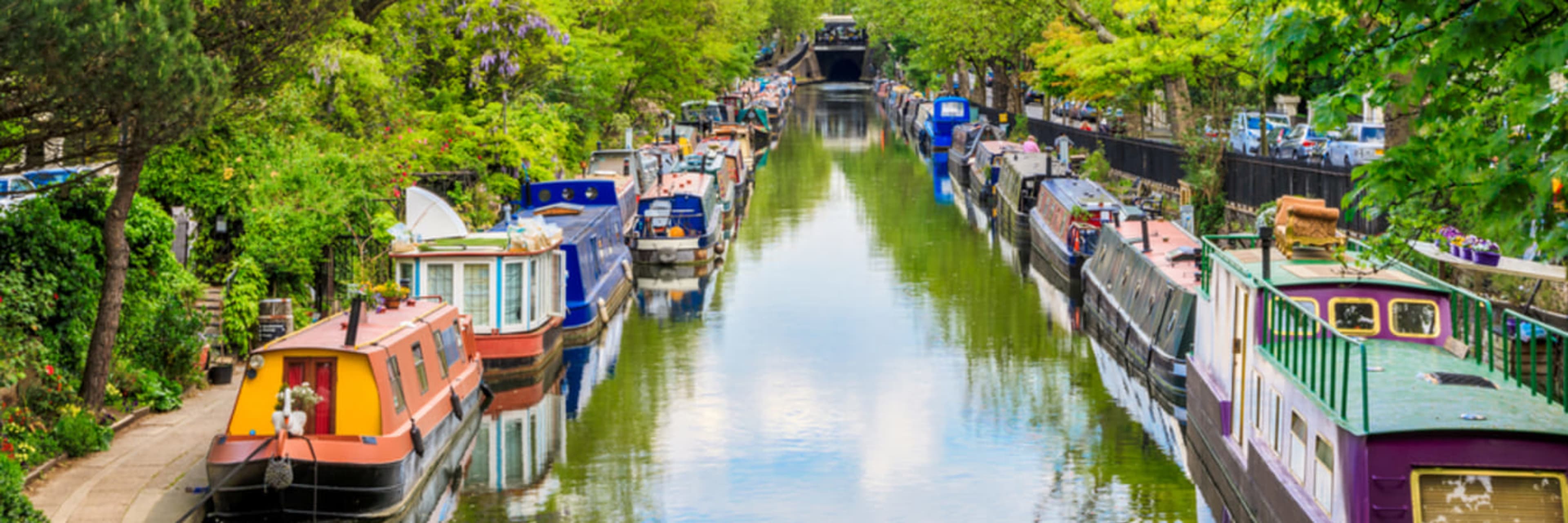 Colorful barges moored along Regent's Canal.